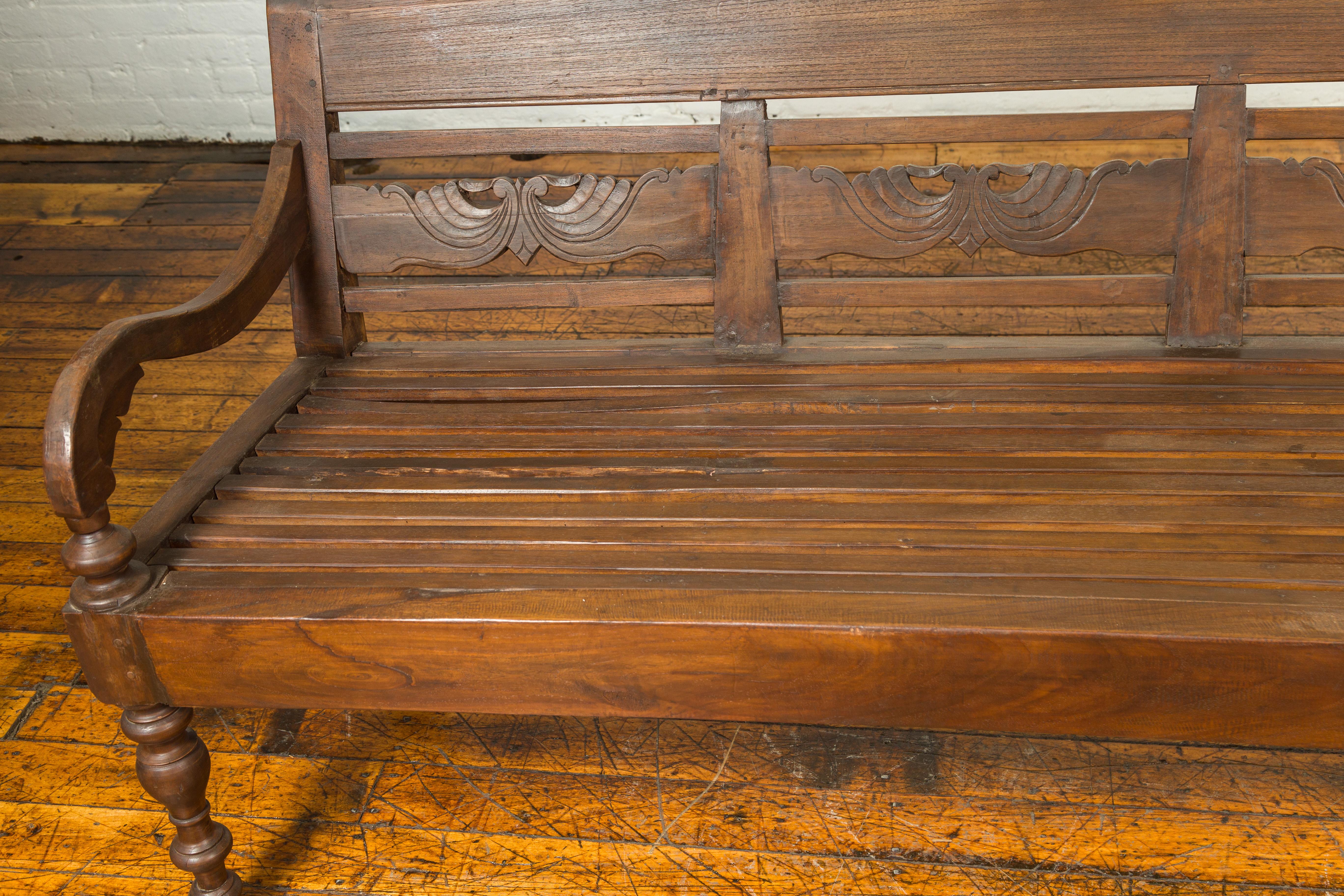 Dutch Colonial Late 19th Century Bench with Carved Back and Scrolling Arms In Good Condition In Yonkers, NY