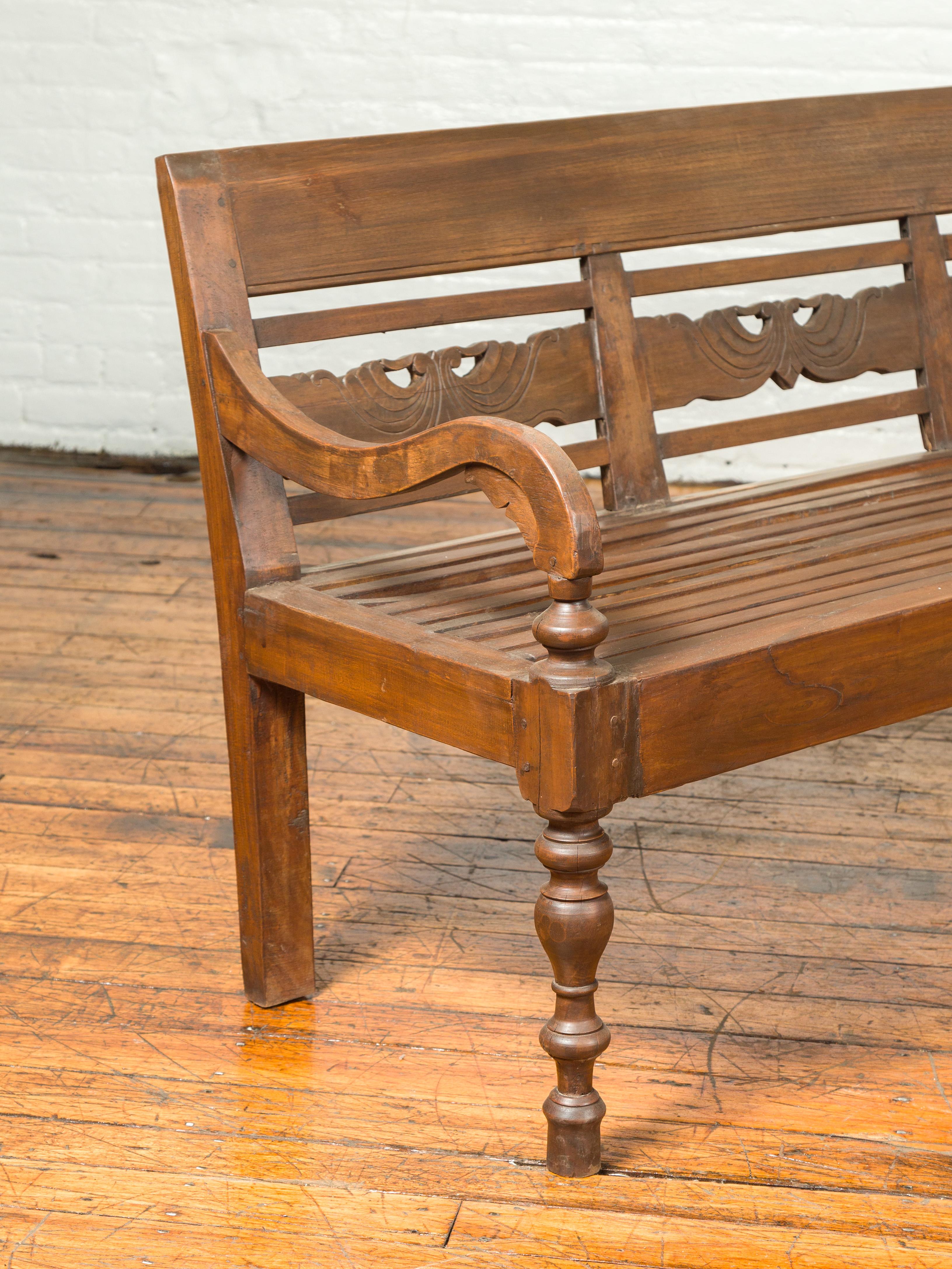 Dutch Colonial Late 19th Century Bench with Carved Back and Scrolling Arms 1