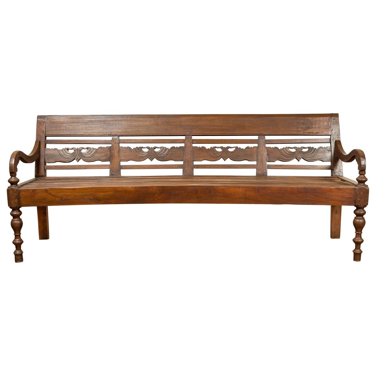 Dutch Colonial Late 19th Century Bench with Carved Back and Scrolling Arms