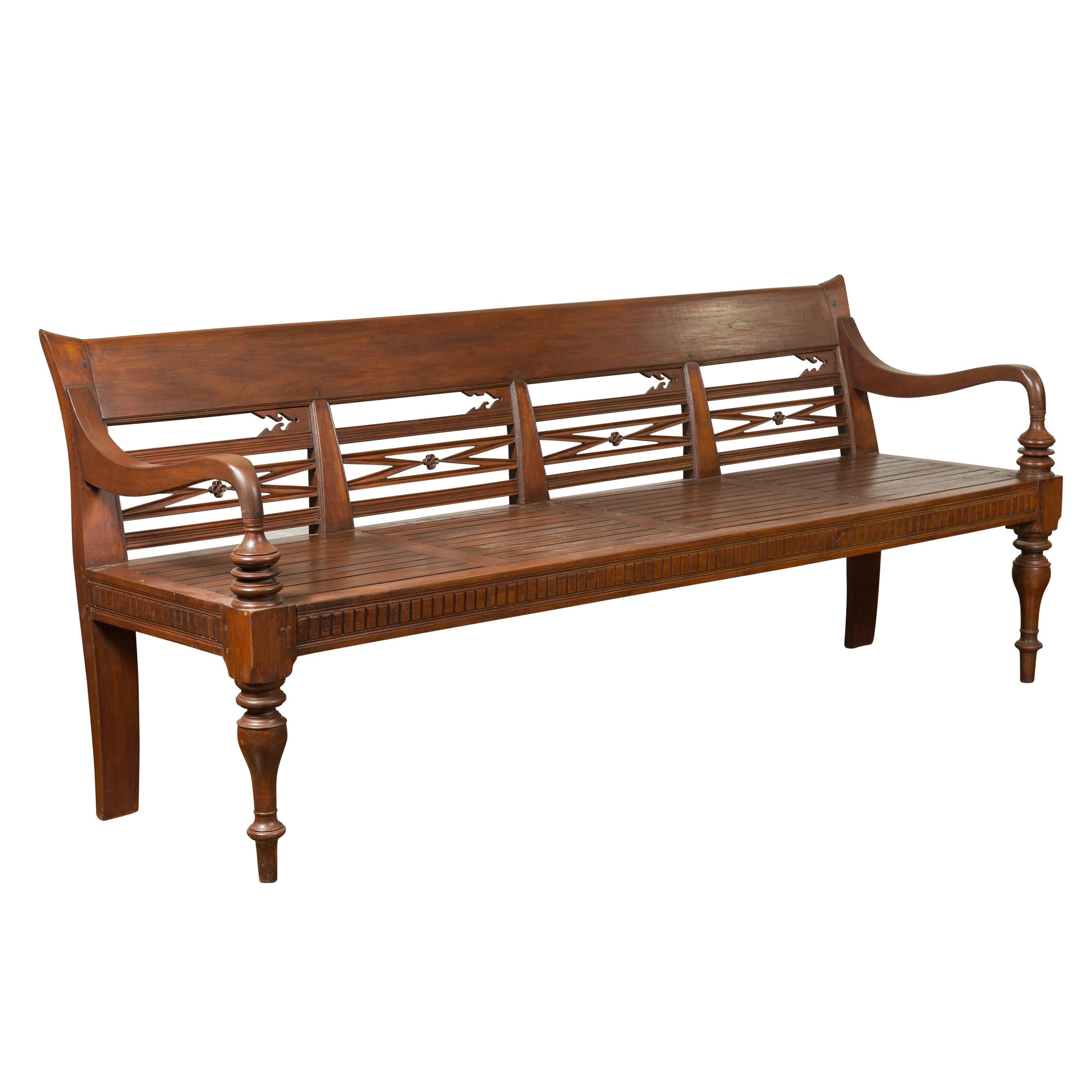 Dutch Colonial Late 19th Century Bench with Pierced Back and Scrolling Arms