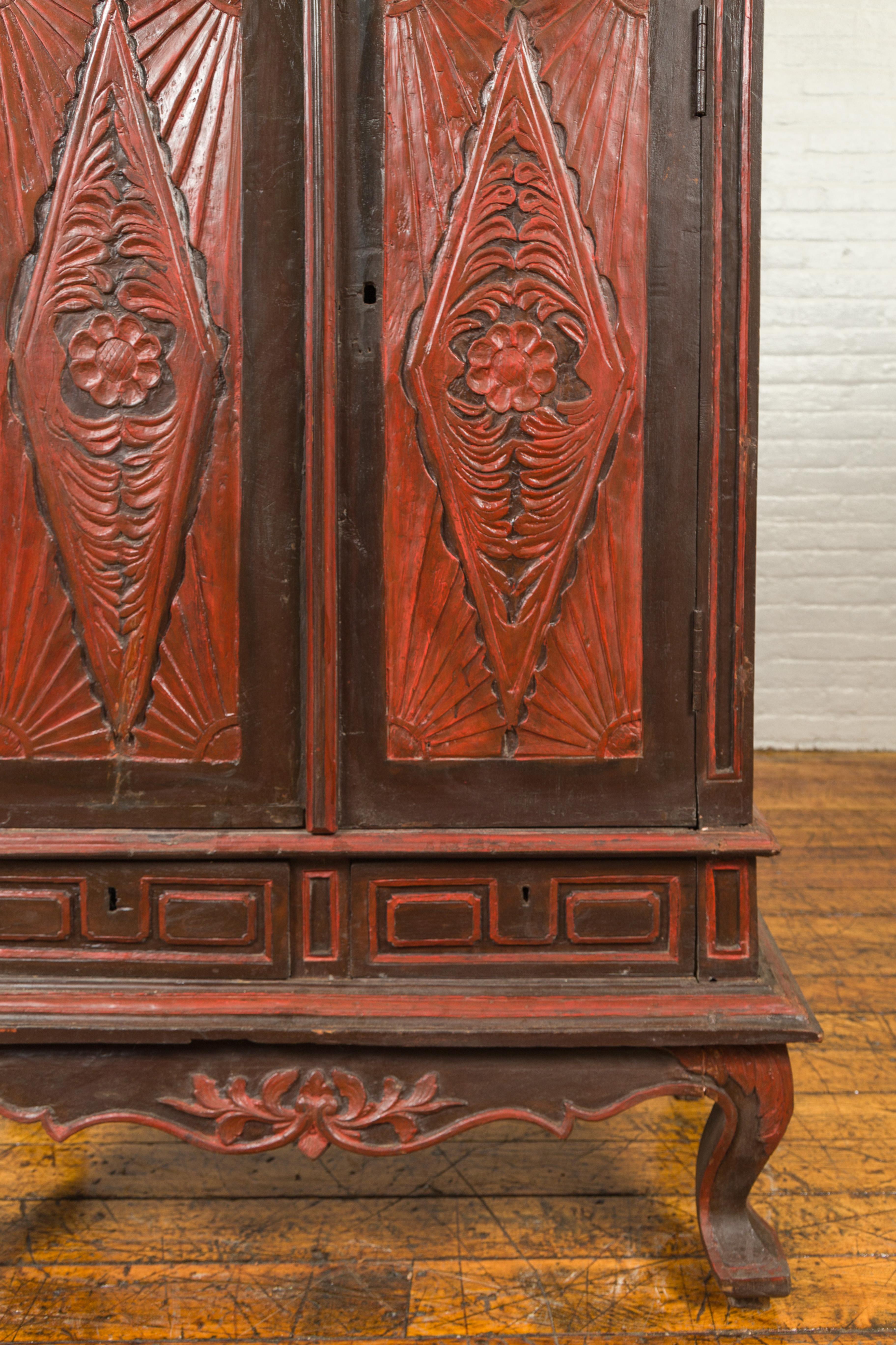 Dutch Colonial Late 19th Century Bonnet Top Cabinet with Carved Doors and Apron For Sale 2