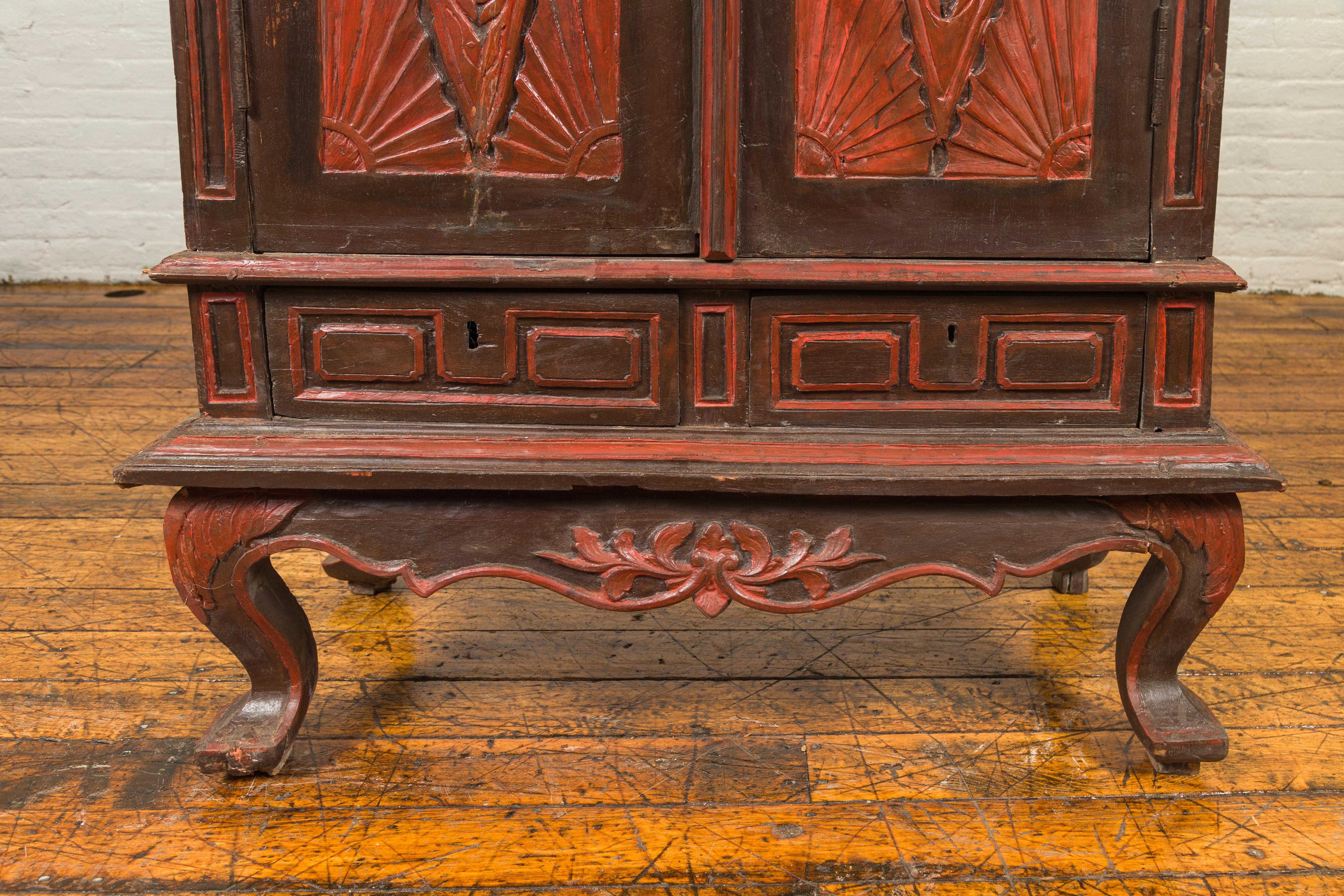 Dutch Colonial Late 19th Century Bonnet Top Cabinet with Carved Doors and Apron For Sale 5