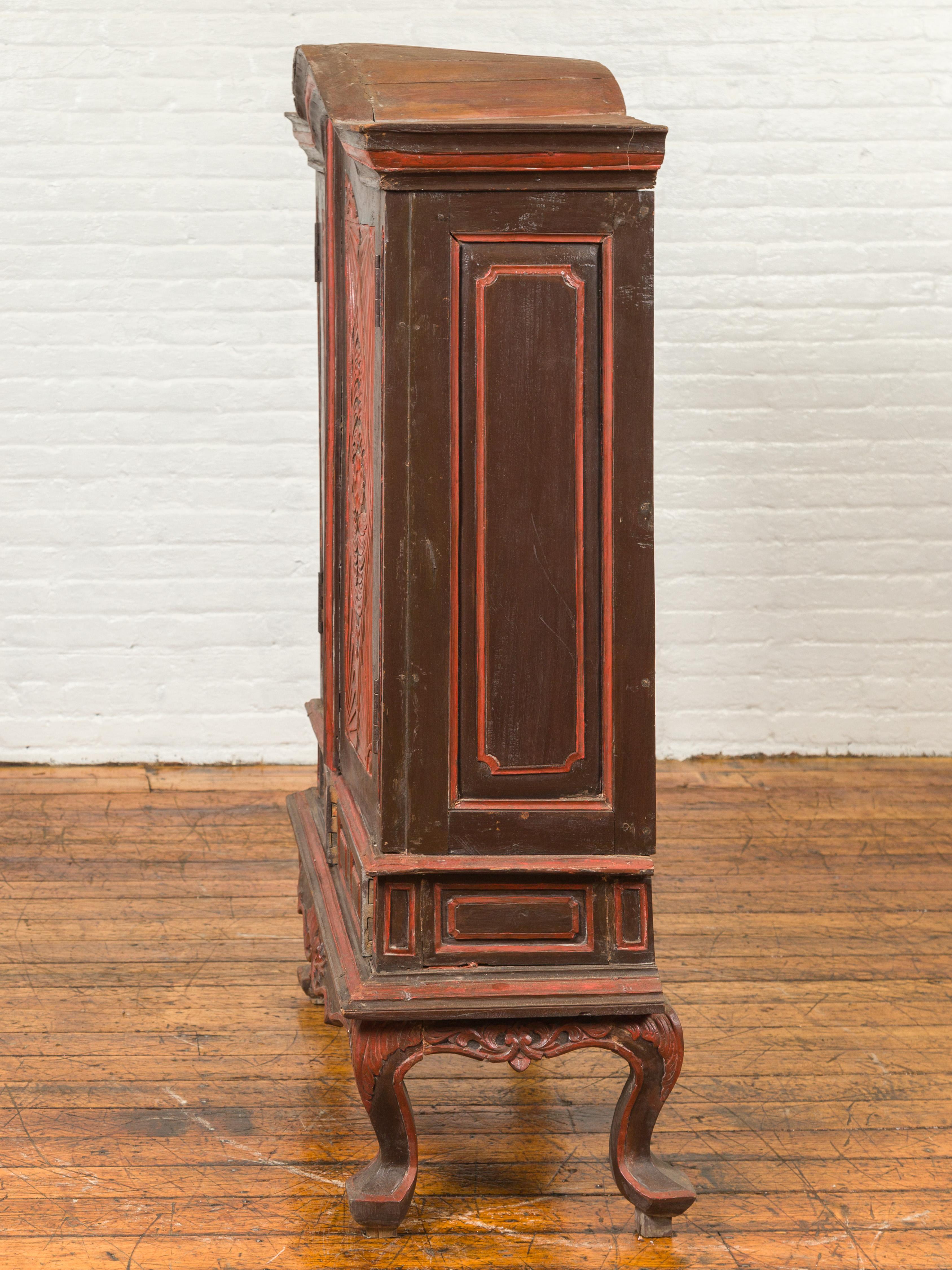 Dutch Colonial Late 19th Century Bonnet Top Cabinet with Carved Doors and Apron For Sale 10