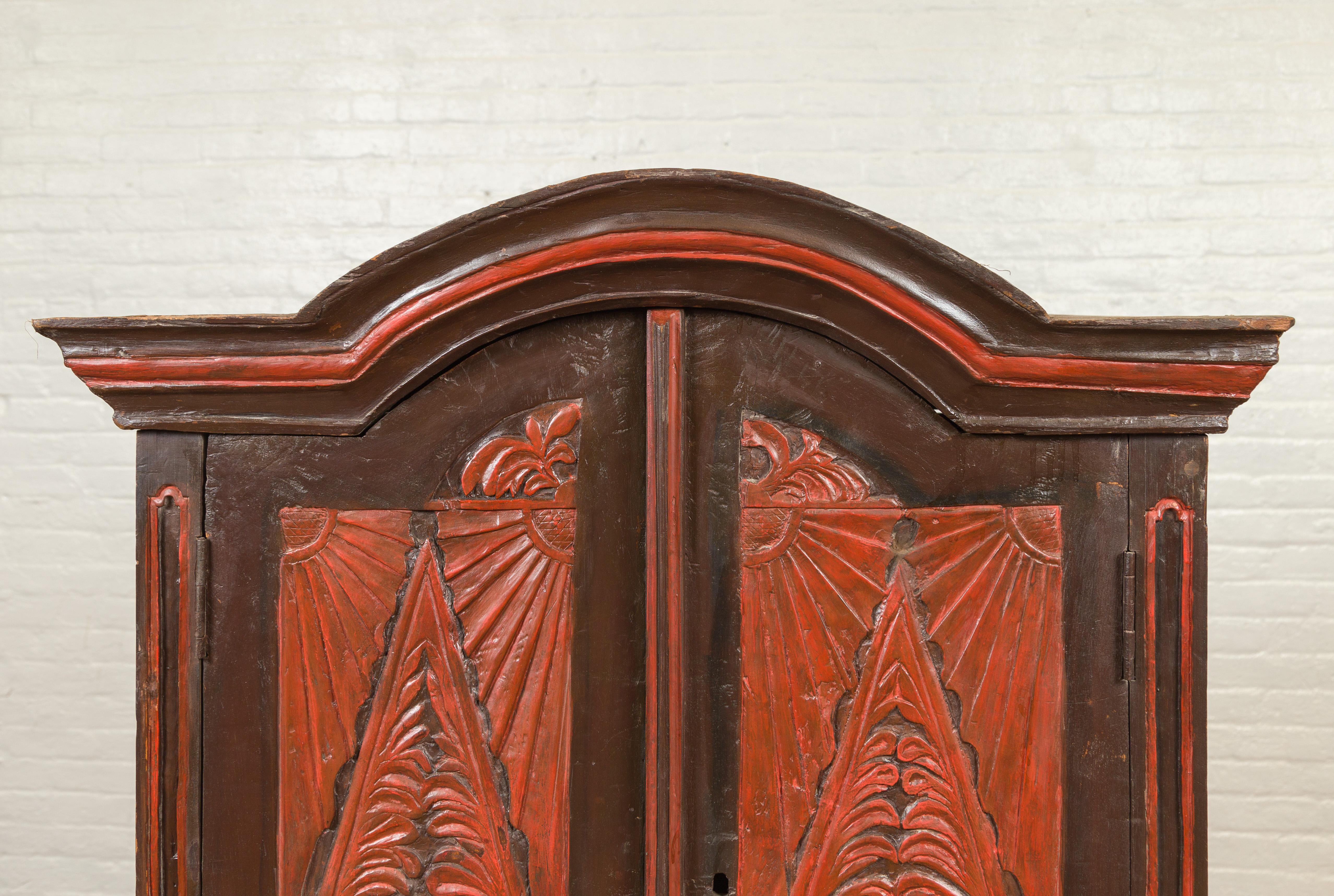 Glass Dutch Colonial Late 19th Century Bonnet Top Cabinet with Carved Doors and Apron For Sale