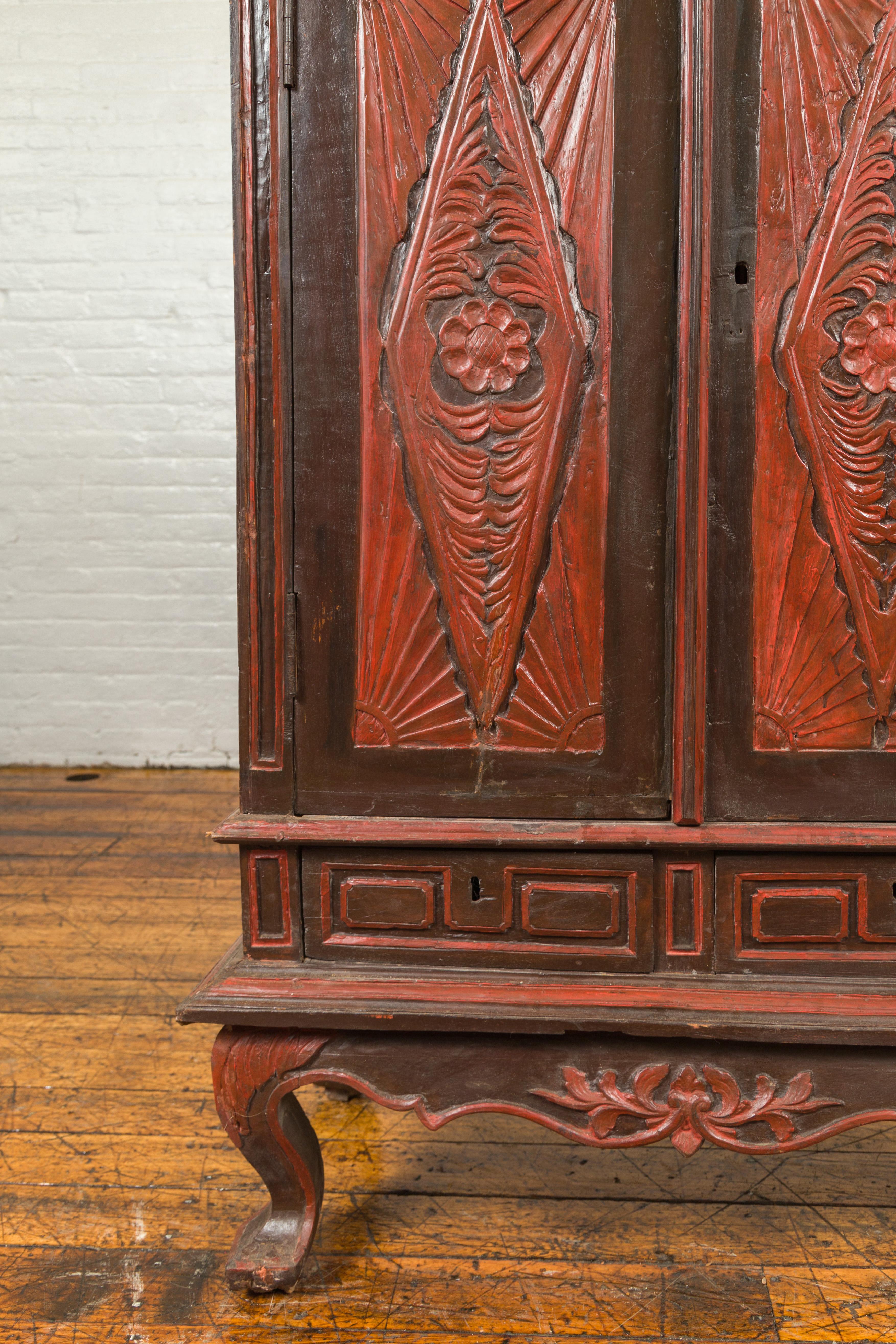 Dutch Colonial Late 19th Century Bonnet Top Cabinet with Carved Doors and Apron For Sale 1