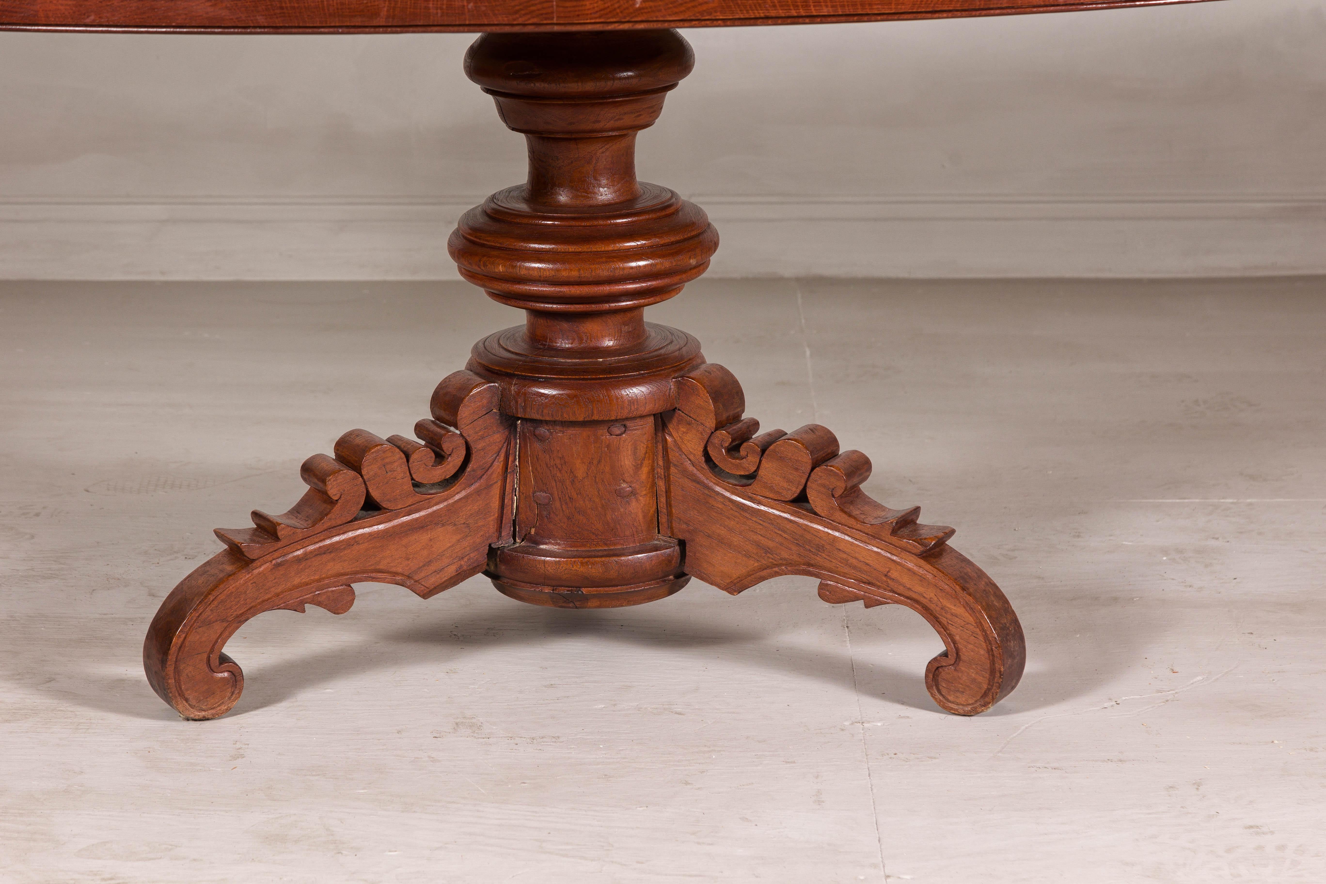 Dutch Colonial Oval Pedestal Dining Table with Scrolling Base, Late 19th Century For Sale 4