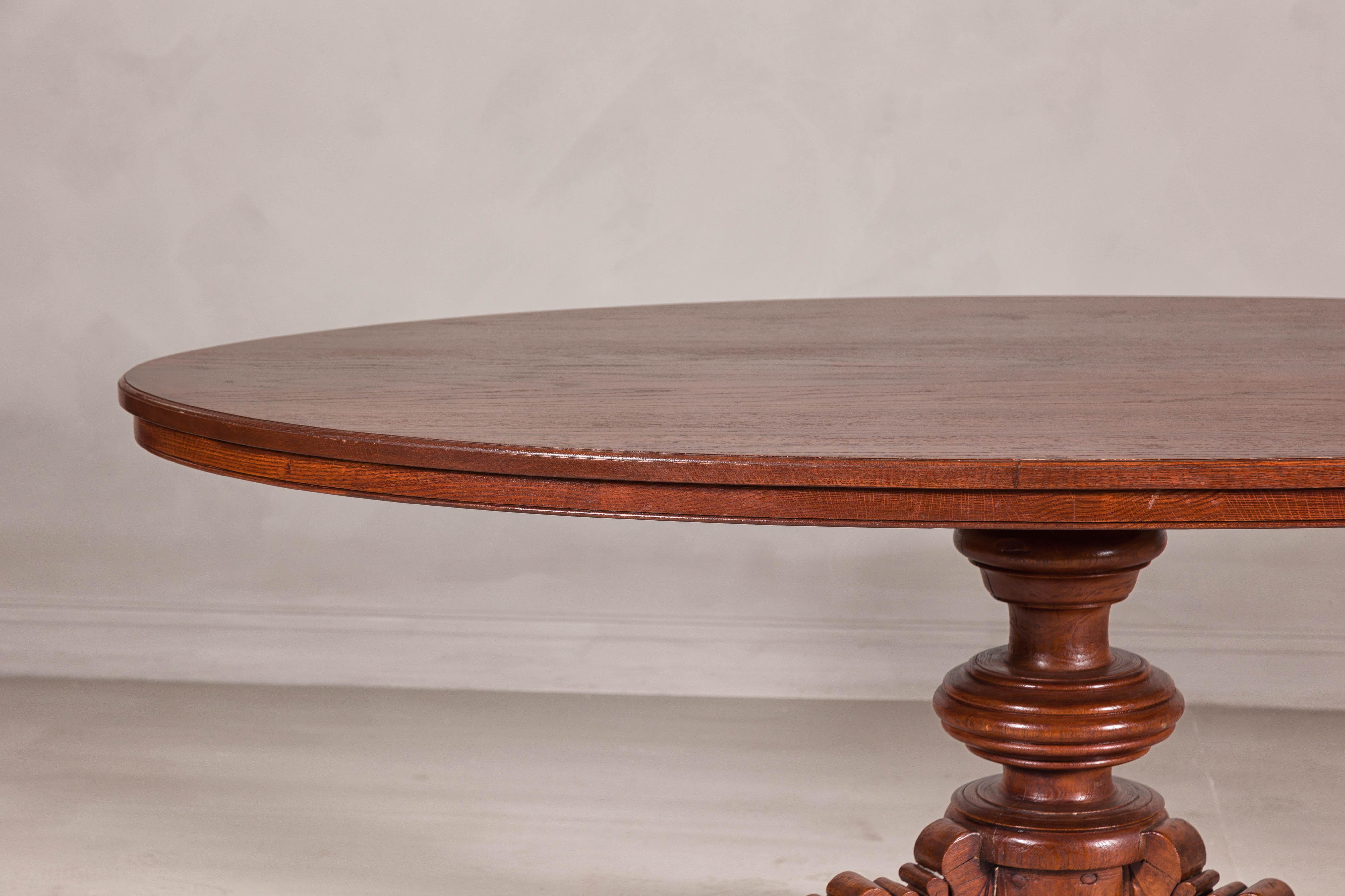 Dutch Colonial Oval Pedestal Dining Table with Scrolling Base, Late 19th Century For Sale 6