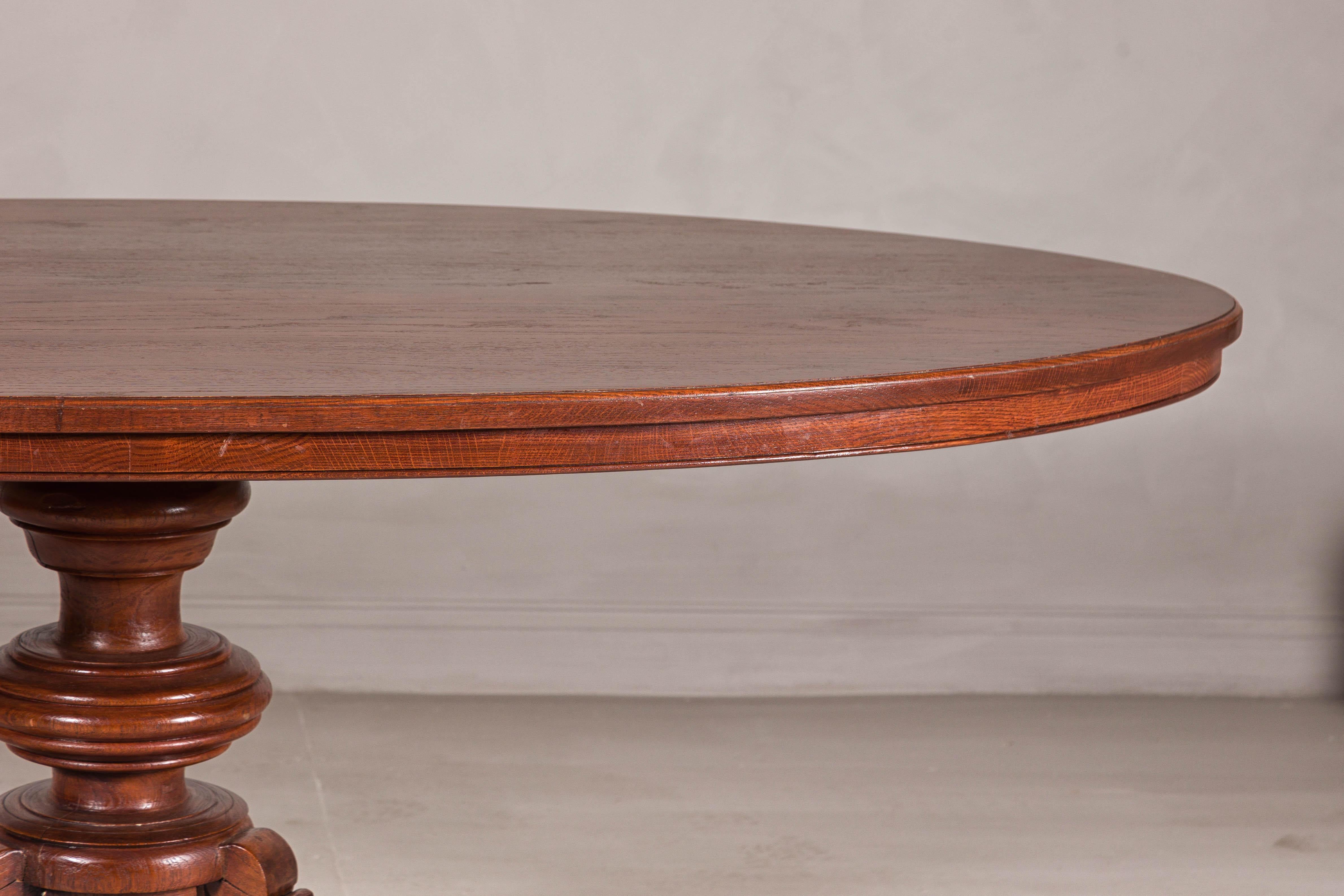 Dutch Colonial Oval Pedestal Dining Table with Scrolling Base, Late 19th Century For Sale 8