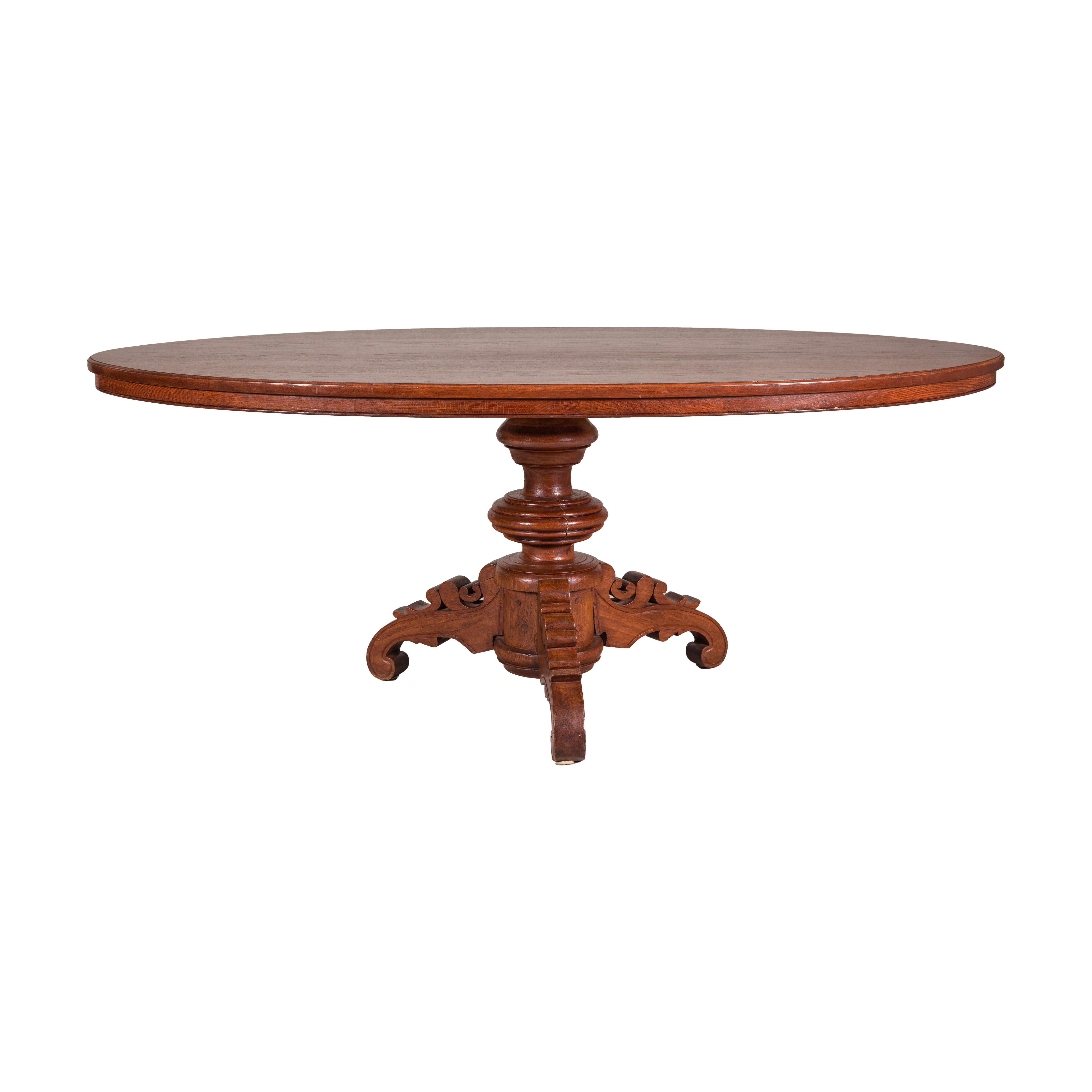 Dutch Colonial Oval Pedestal Dining Table with Scrolling Base, Late 19th Century For Sale 9
