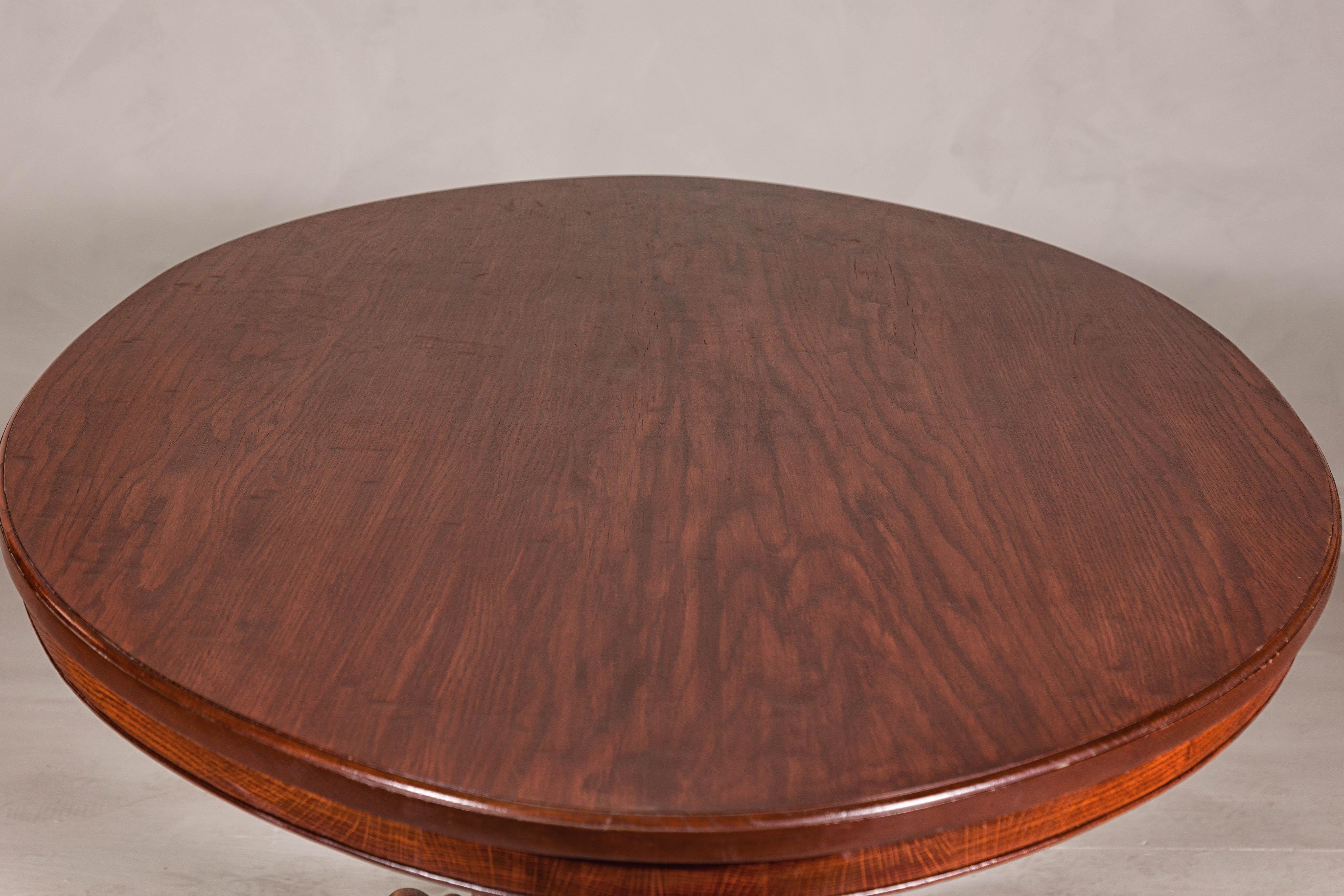 Dutch Colonial Oval Pedestal Dining Table with Scrolling Base, Late 19th Century For Sale 1