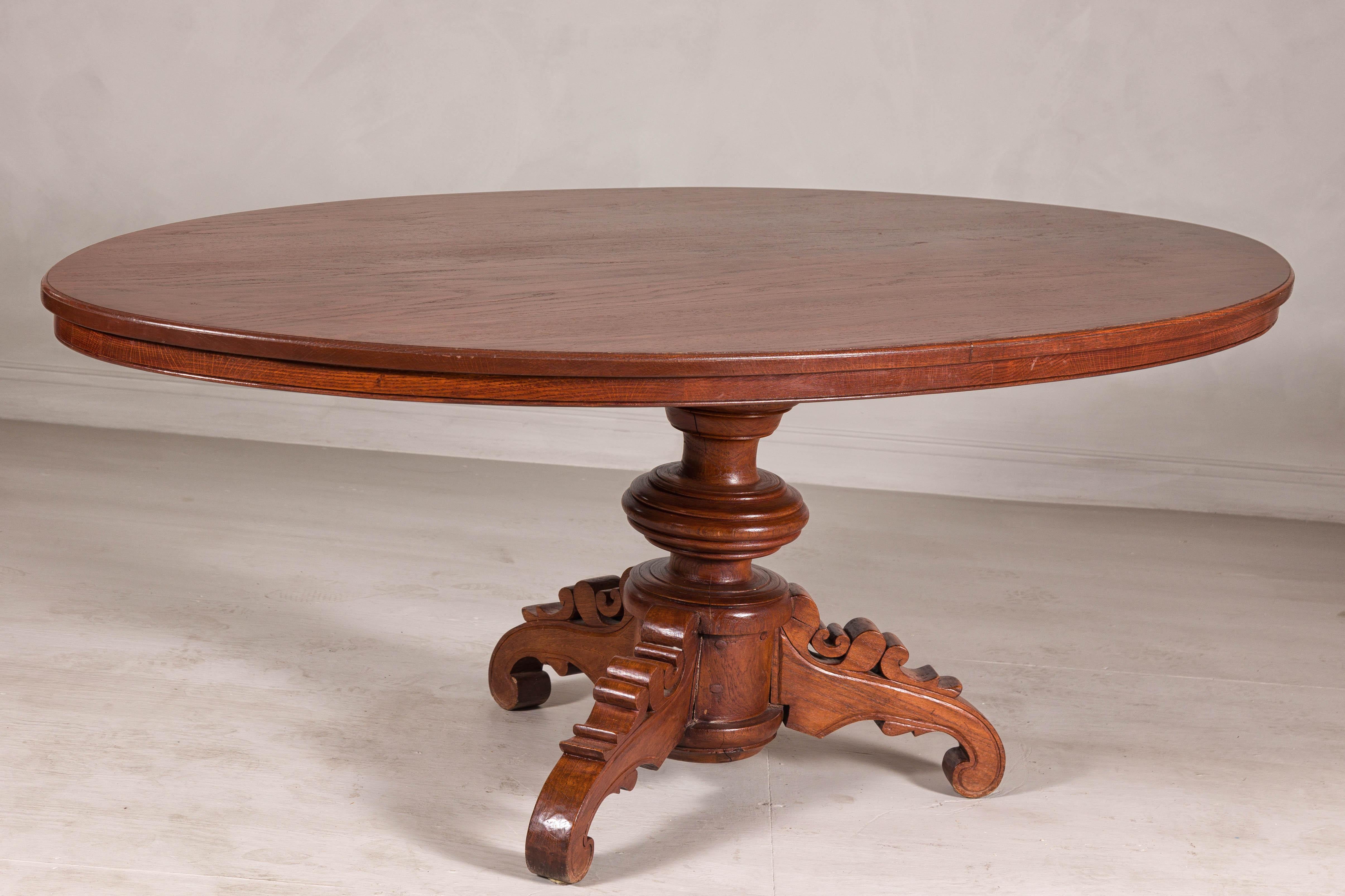 Dutch Colonial Oval Pedestal Dining Table with Scrolling Base, Late 19th Century For Sale 3