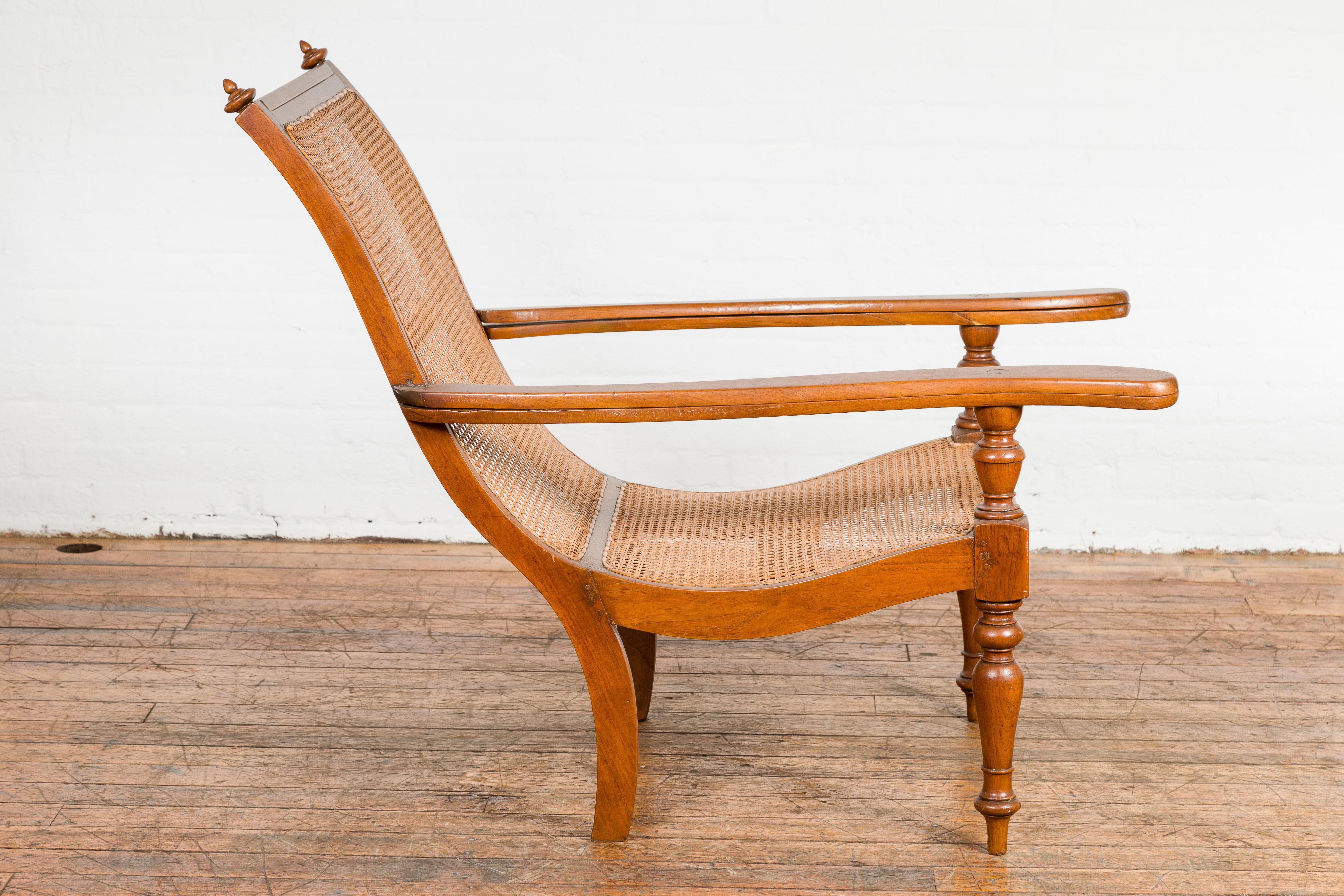 Cane Dutch Colonial Period Wood and Rattan Lounge Chair with Extending Arms For Sale
