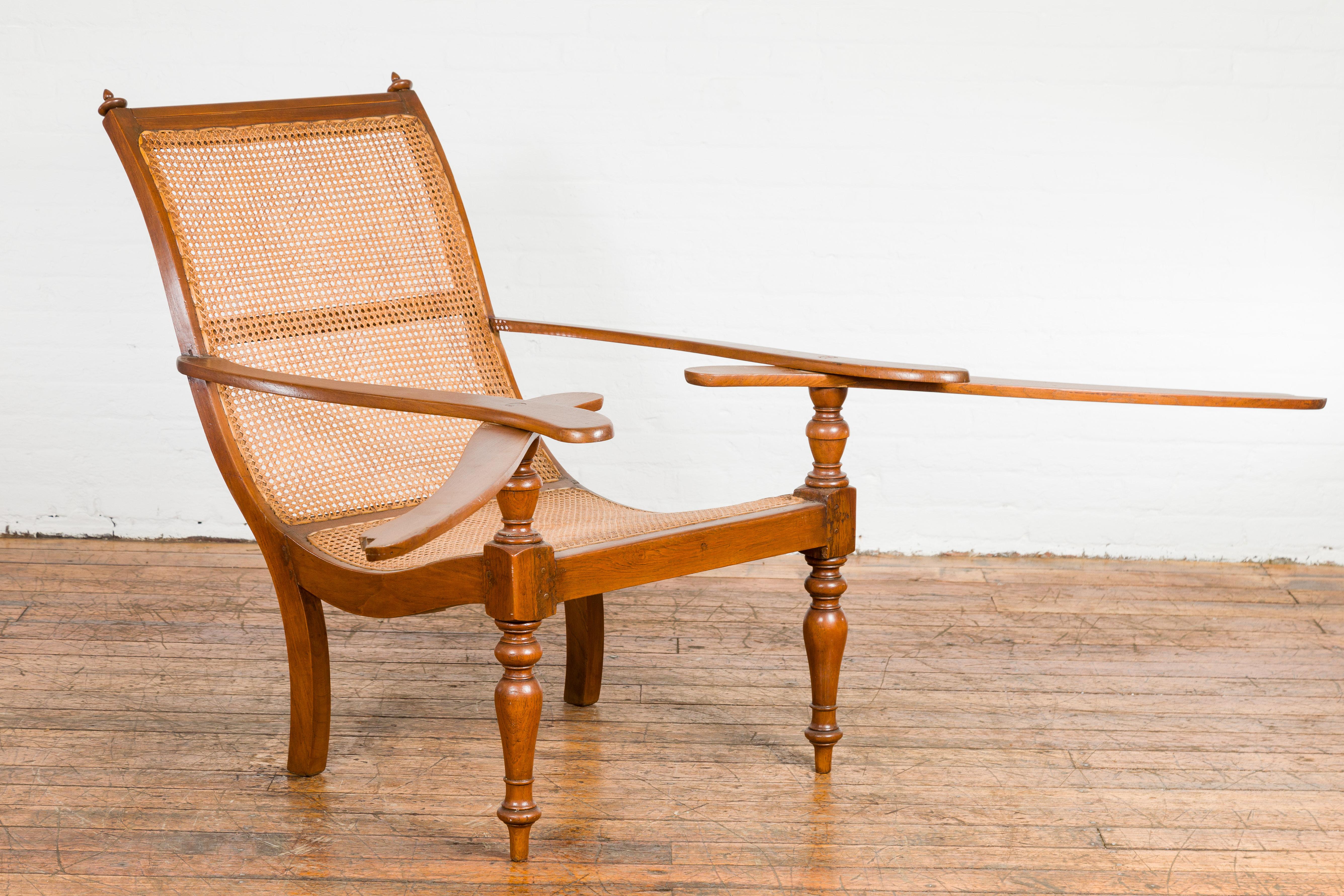 Dutch Colonial Period Wood and Rattan Lounge Chair with Extending Arms In Good Condition For Sale In Yonkers, NY