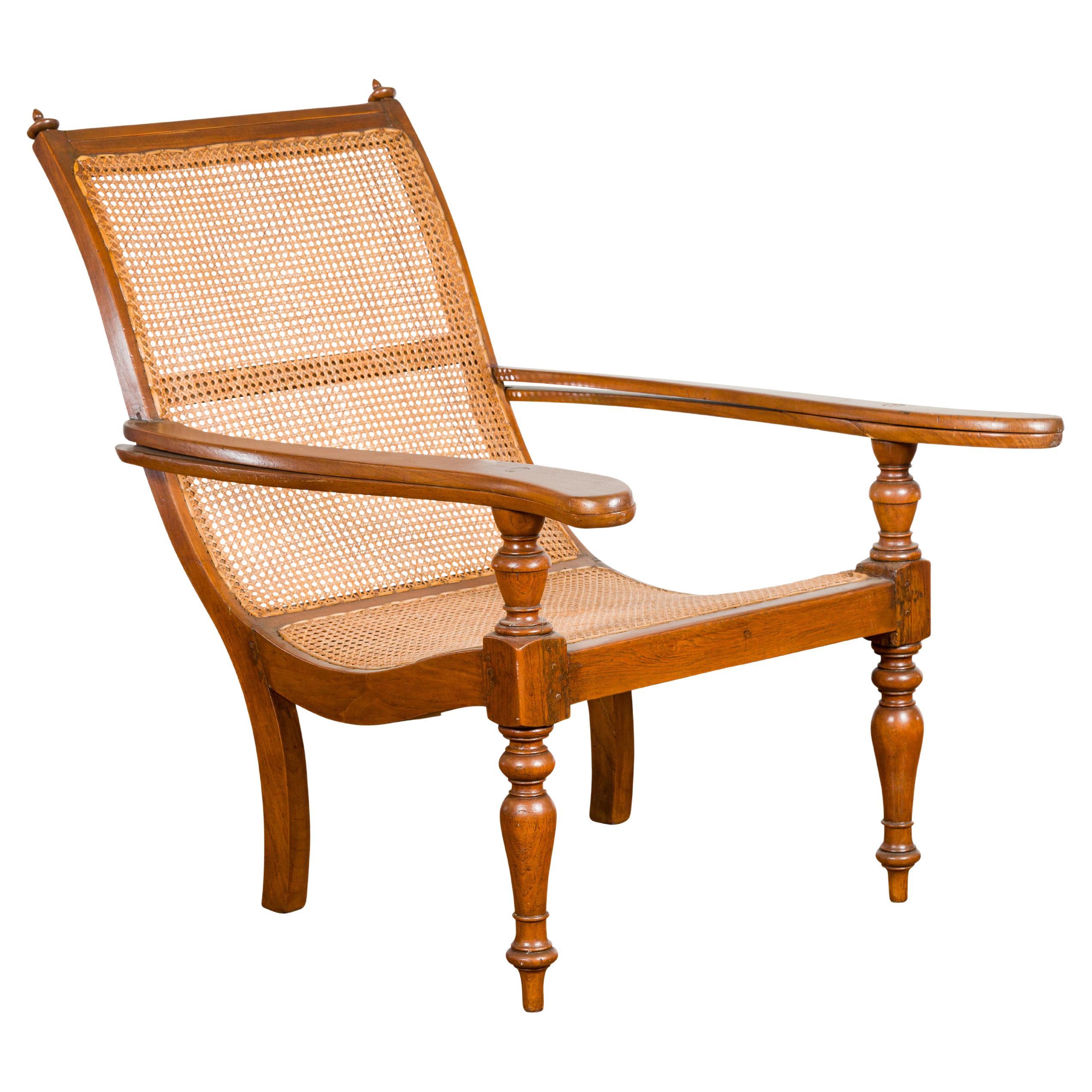 Dutch Colonial Period Wood and Rattan Lounge Chair with Extending Arms For Sale