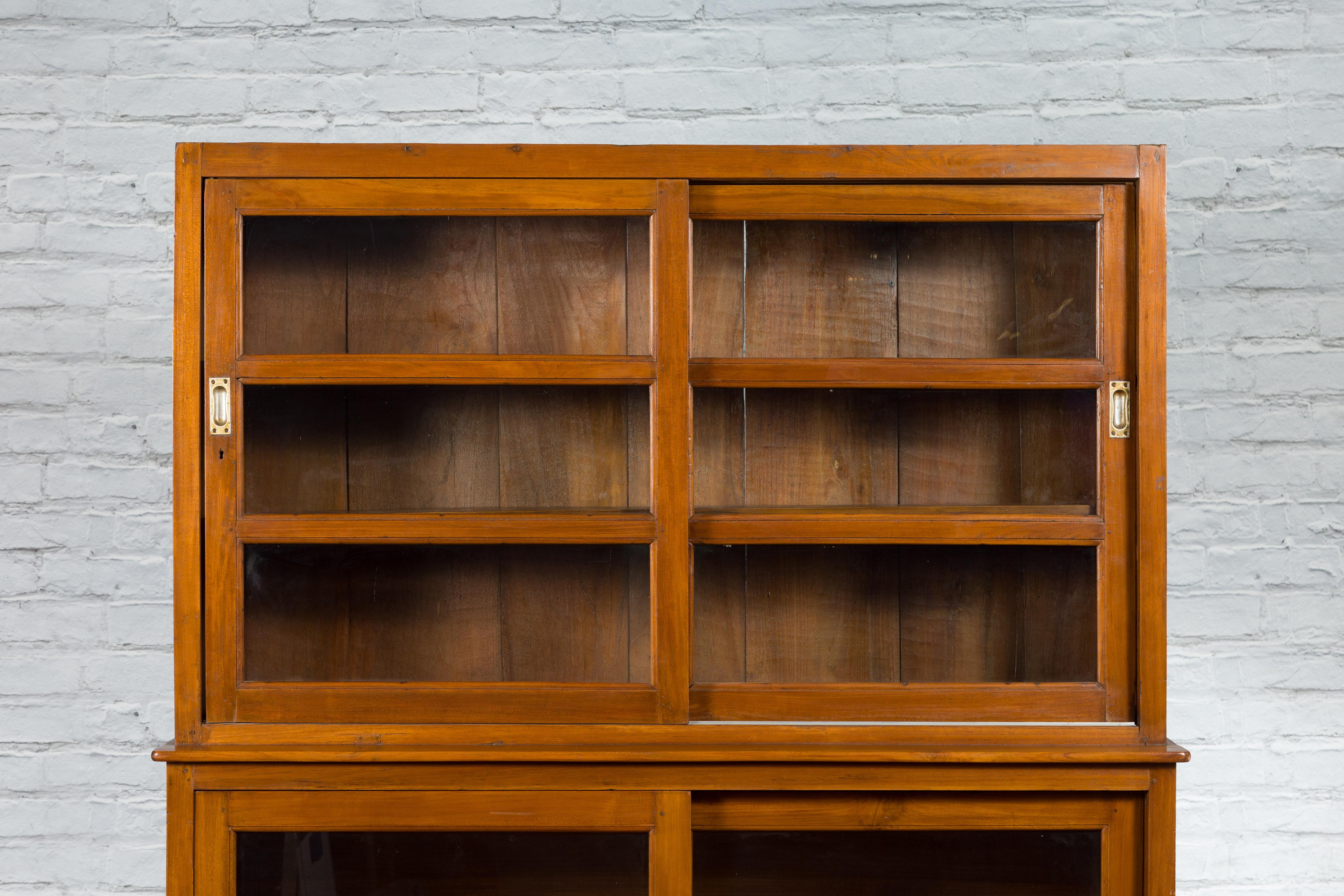 Dutch Colonial Teak Wood Vintage Bookcase with Sliding Glass Doors In Good Condition In Yonkers, NY