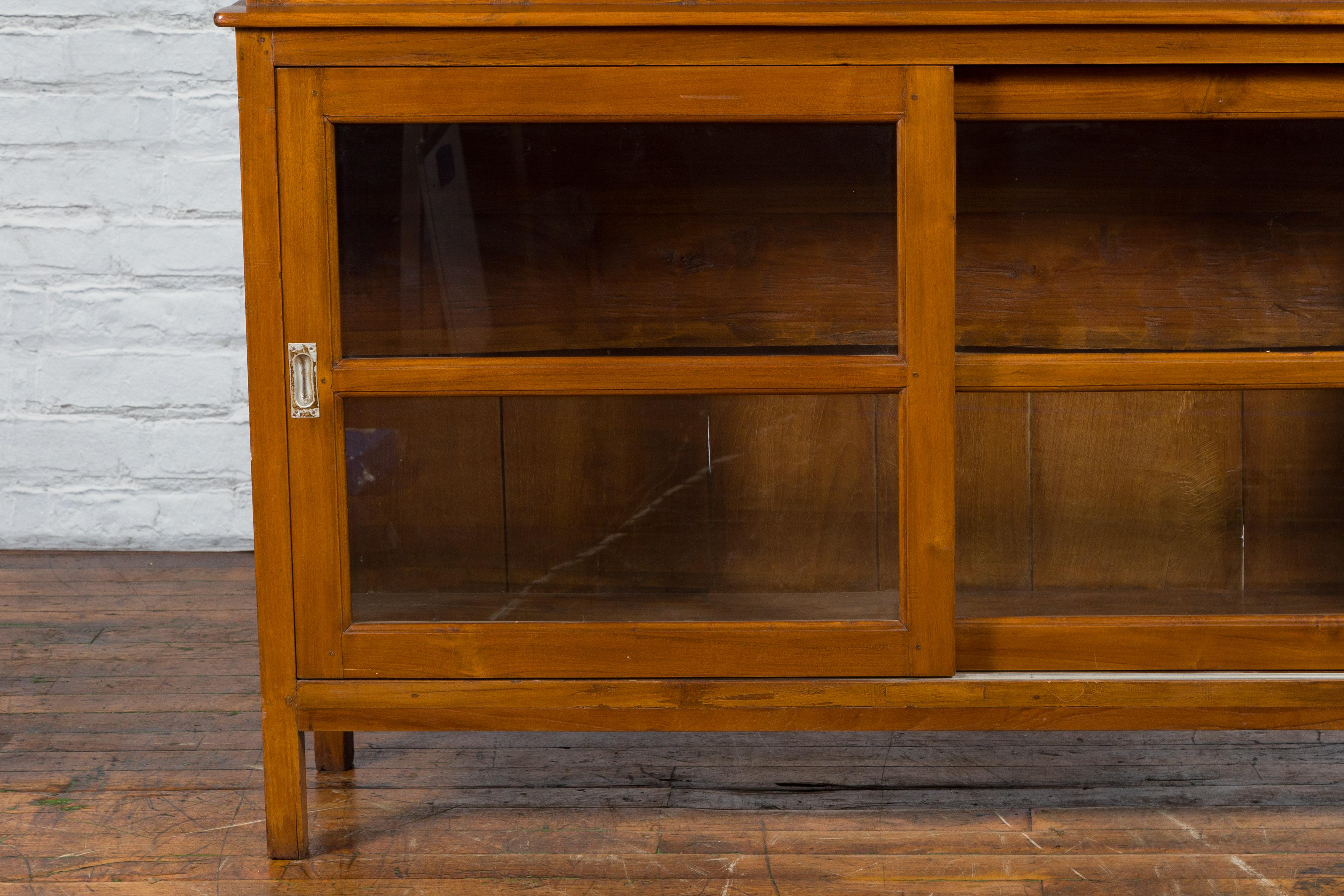 20th Century Dutch Colonial Teak Wood Vintage Bookcase with Sliding Glass Doors