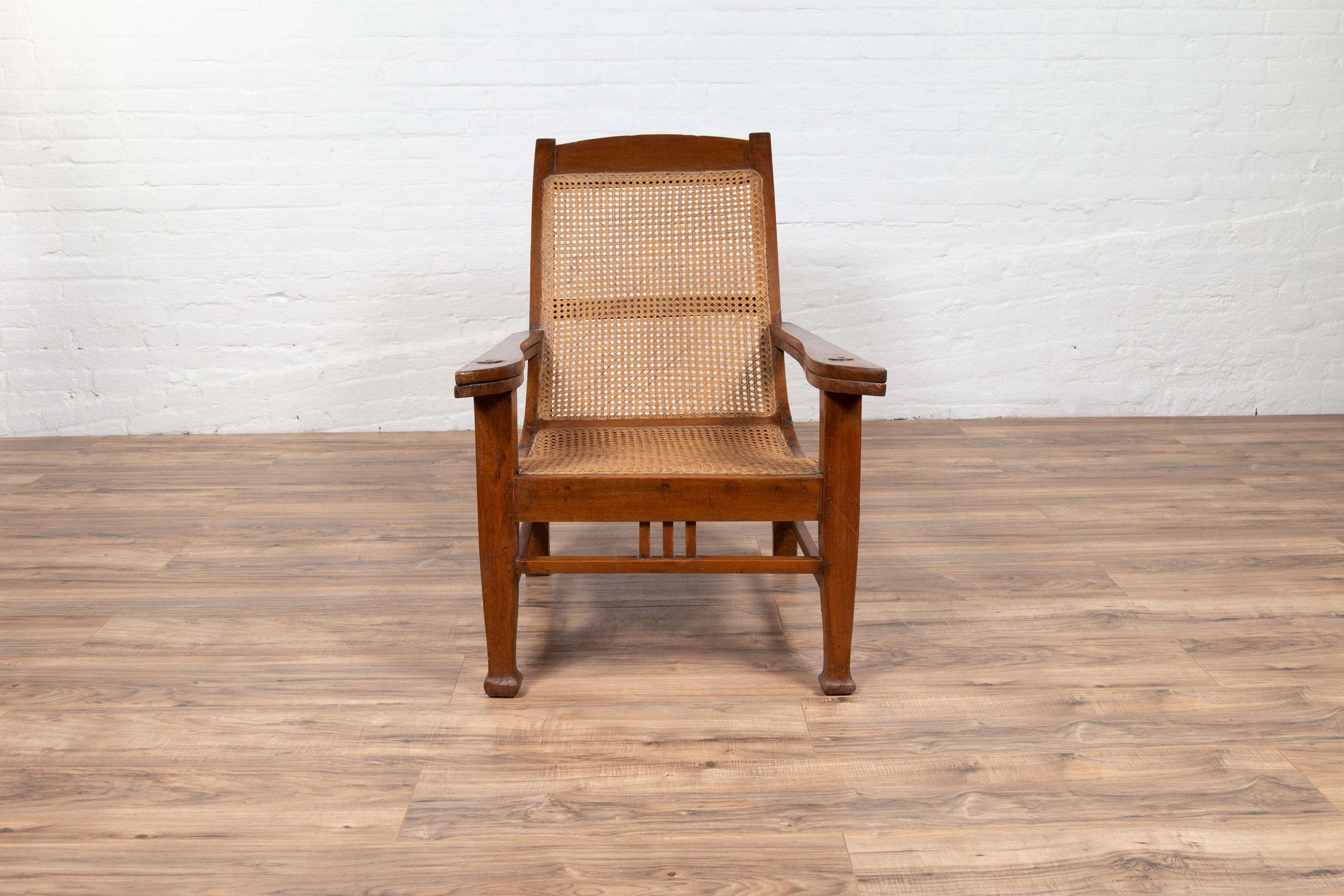 20th Century Dutch Colonial Vintage Plantation Lounge Chair with Curving Seat and Rattan