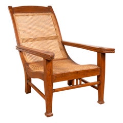 Dutch Colonial Vintage Plantation Lounge Chair with Curving Seat and Rattan