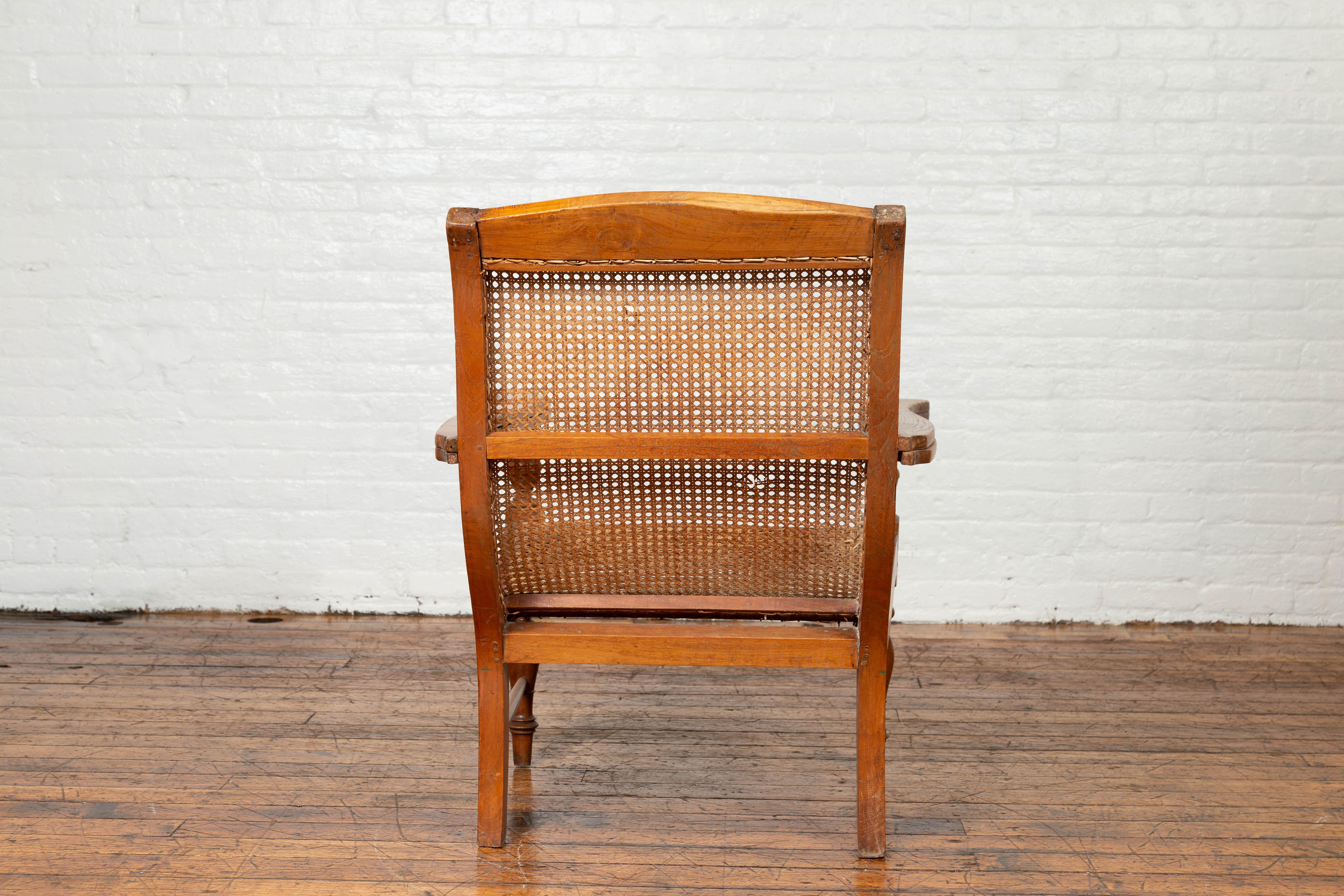 Indonesian Dutch Colonial Vintage Teak Plantation Lounge Chair with Curving Seat and Rattan