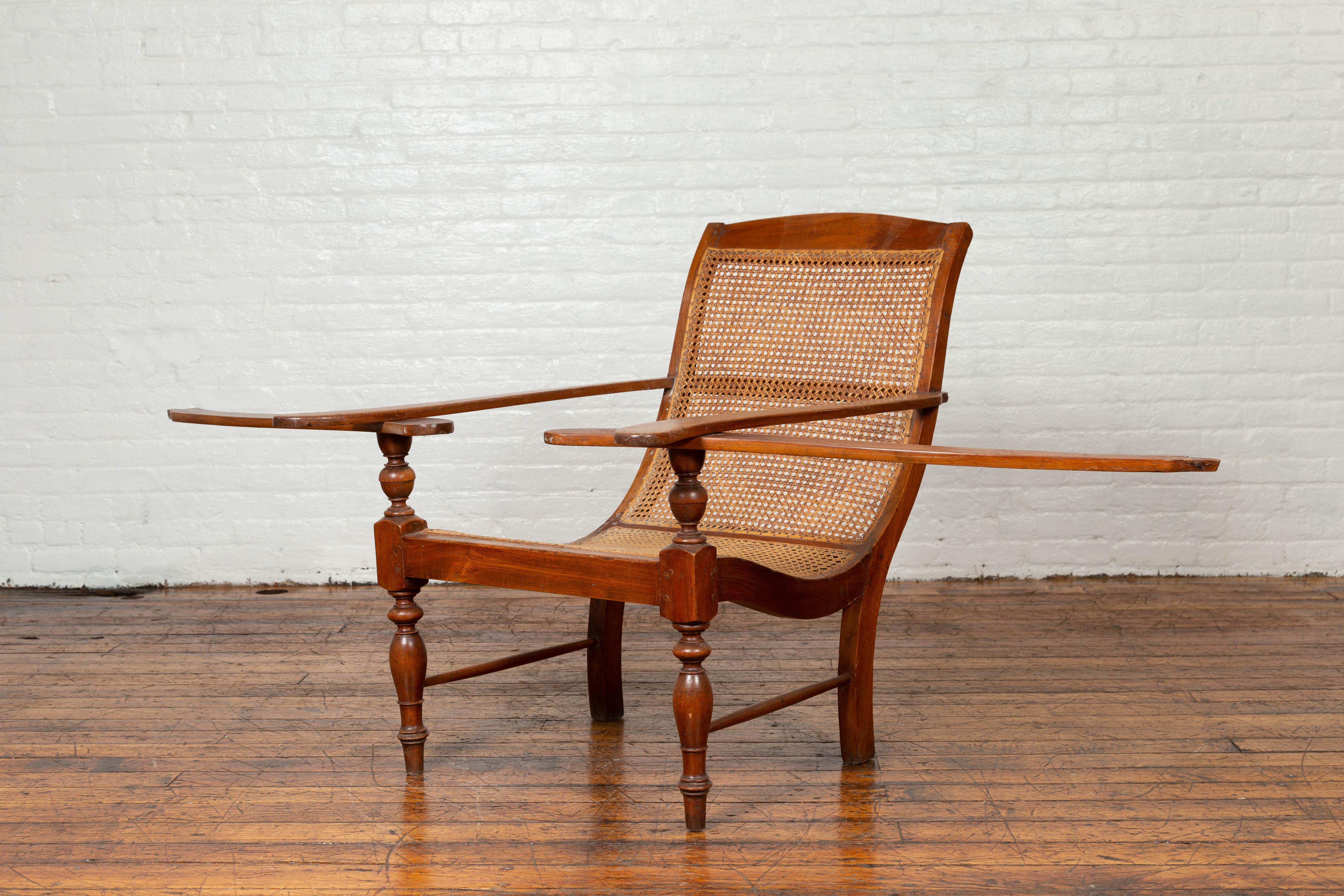 Dutch Colonial Vintage Teak Plantation Lounge Chair with Curving Seat and Rattan In Good Condition In Yonkers, NY