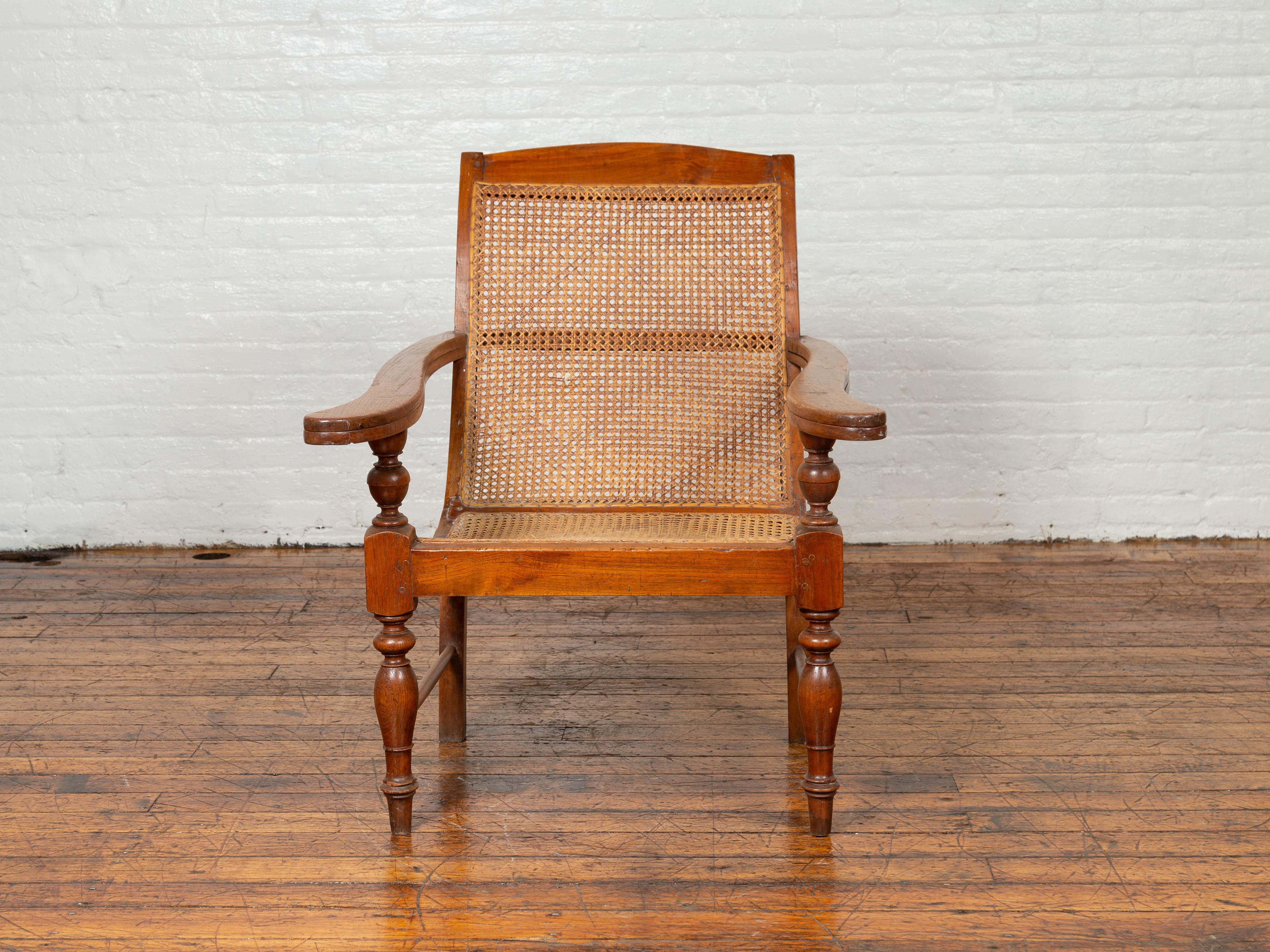 20th Century Dutch Colonial Vintage Teak Plantation Lounge Chair with Curving Seat and Rattan