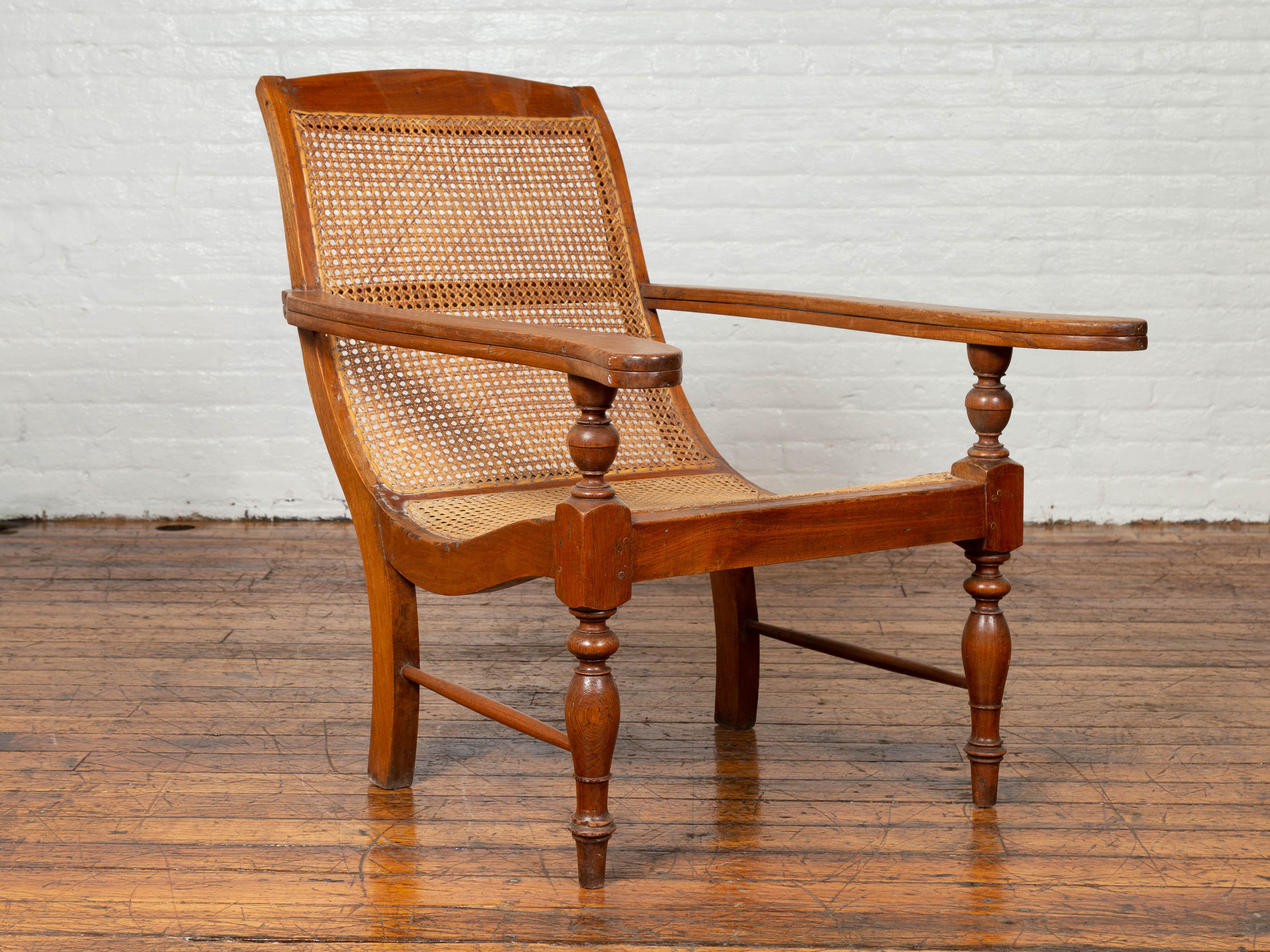 Dutch Colonial Vintage Teak Plantation Lounge Chair with Curving Seat and Rattan 1