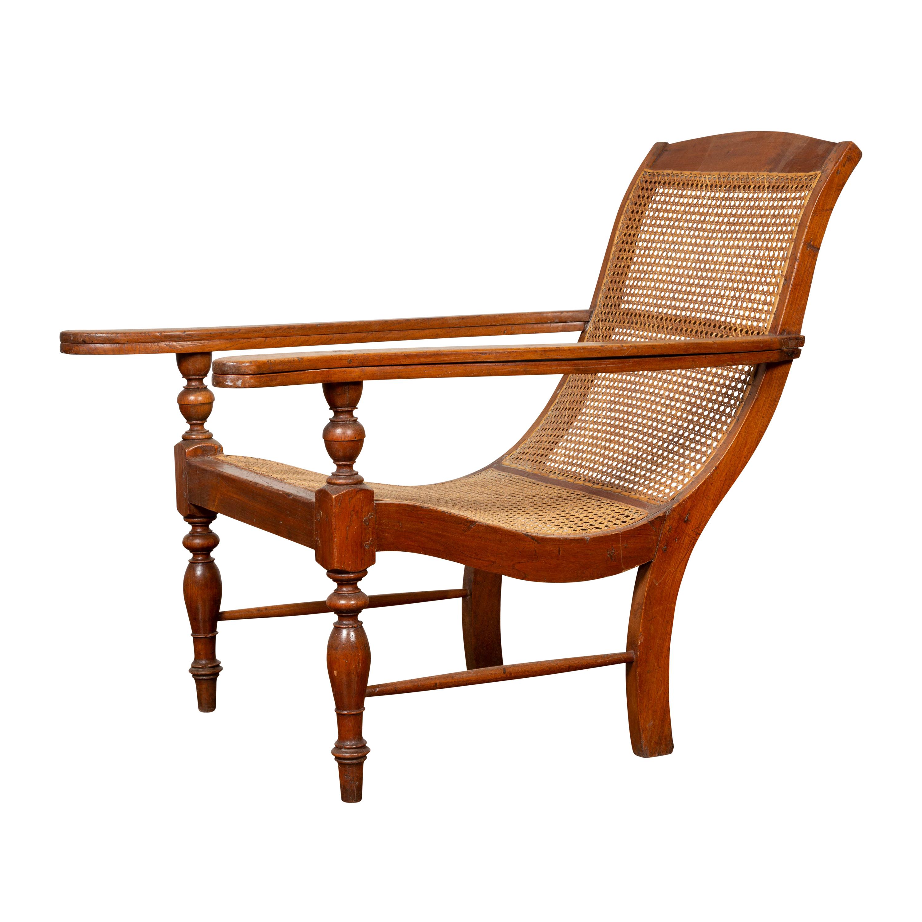 Dutch Colonial Vintage Teak Plantation Lounge Chair with Curving Seat and Rattan