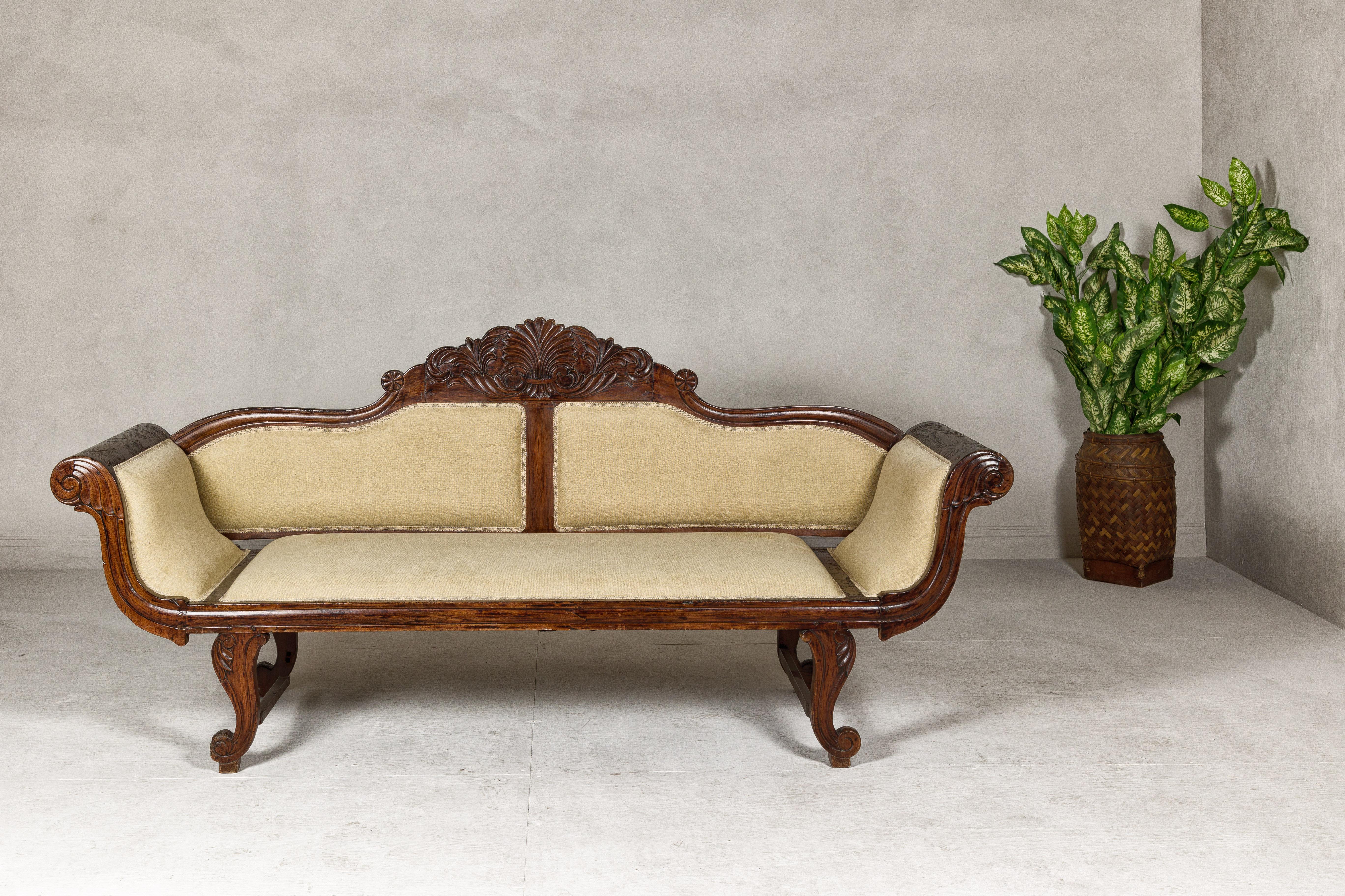 Asian Dutch Colonial Wooden Settee with Carved Crest and Out-Scrolling Arms For Sale