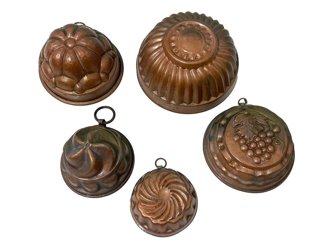 Dutch copper pudding bakeware, molds

Early 20th Century, ca 1900-1910 five pieces of Dutch baking molds for pudding in different shapes and sizes. 
The largest is 13.5 cm diagonal and 6 cm high to the smallest 7.5 cm diagonal. 
The total weight is