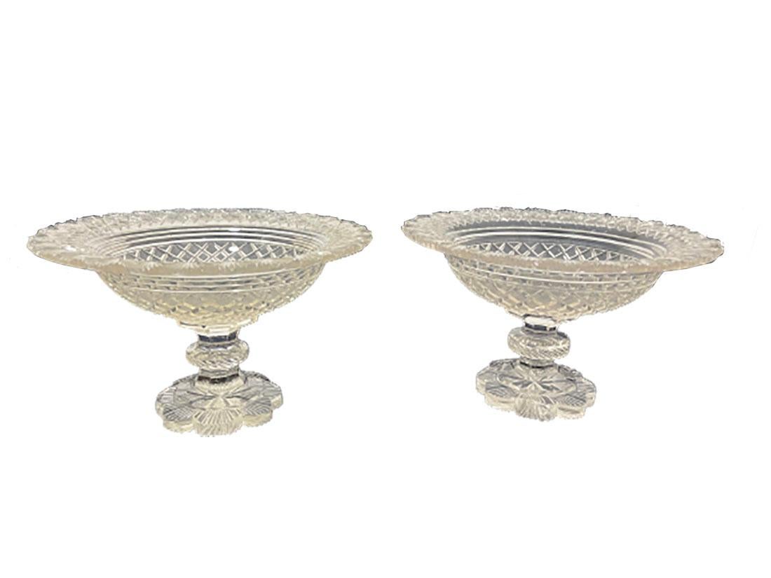 Dutch Crystal footed bowls with diamond and fan cut, ca 1860

2 decorative crystal bowls raised on foot with diamond and fan hand-cut crystal. Dutch, ca 1860. 
Please notice. The bowls have various imperfections, such as at the foot and edges. 
This