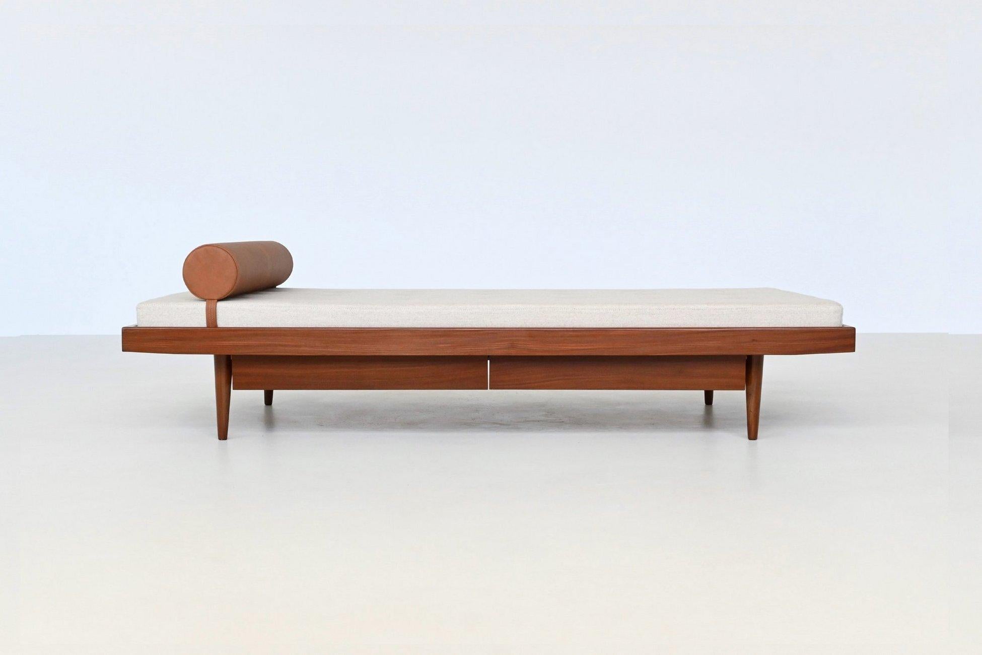 Beautiful shaped Dutch daybed unknown designer or manufacturer, The Netherlands 1960. This Dutch daybed from the 1960s seamlessly blends functionality with classic design, crafted from teak and equipped with a padded mattress upholstered in creme