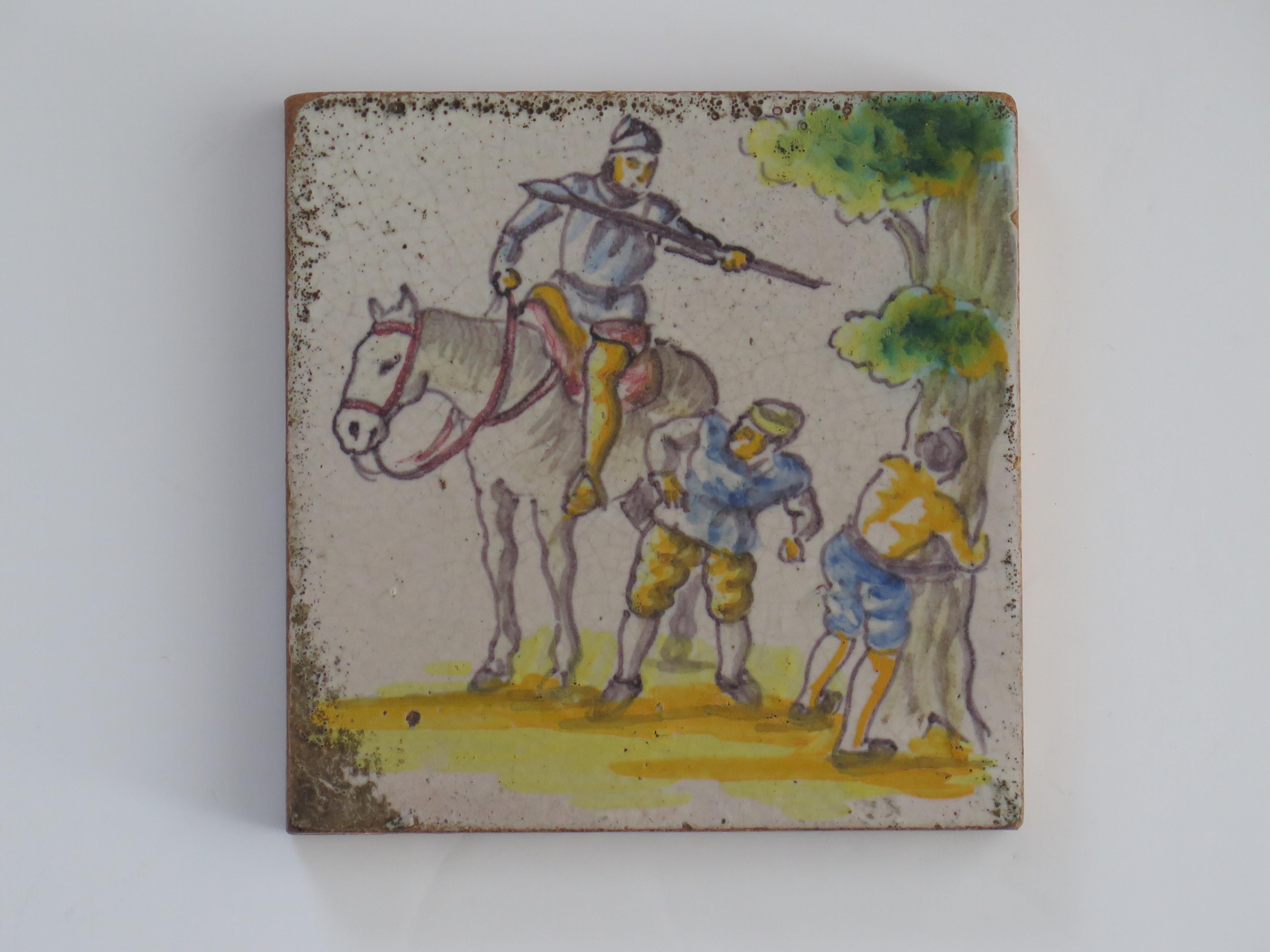 This is a very attractive Delft Polychrome, hand painted earthenware ceramic wall tile dating to the late 18th Century.

The tile is 5.5 inches ( 14cm) square and over 1/2 inches thick. 

The tile is hand painted with polychrome enamels of blue,