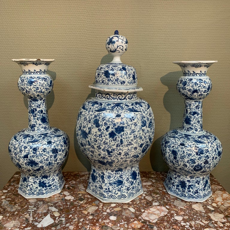 Two Dutch delft baluster vases with floral decor of roses and leaves. 

Place: Delft 
Workshop: De Drie Vergulde Astonne or De Paauw
Owner: Pieter Gerritsz. Kam of David Kam
Date: 1700 - 1720 

This garniture can be attributed to one of the