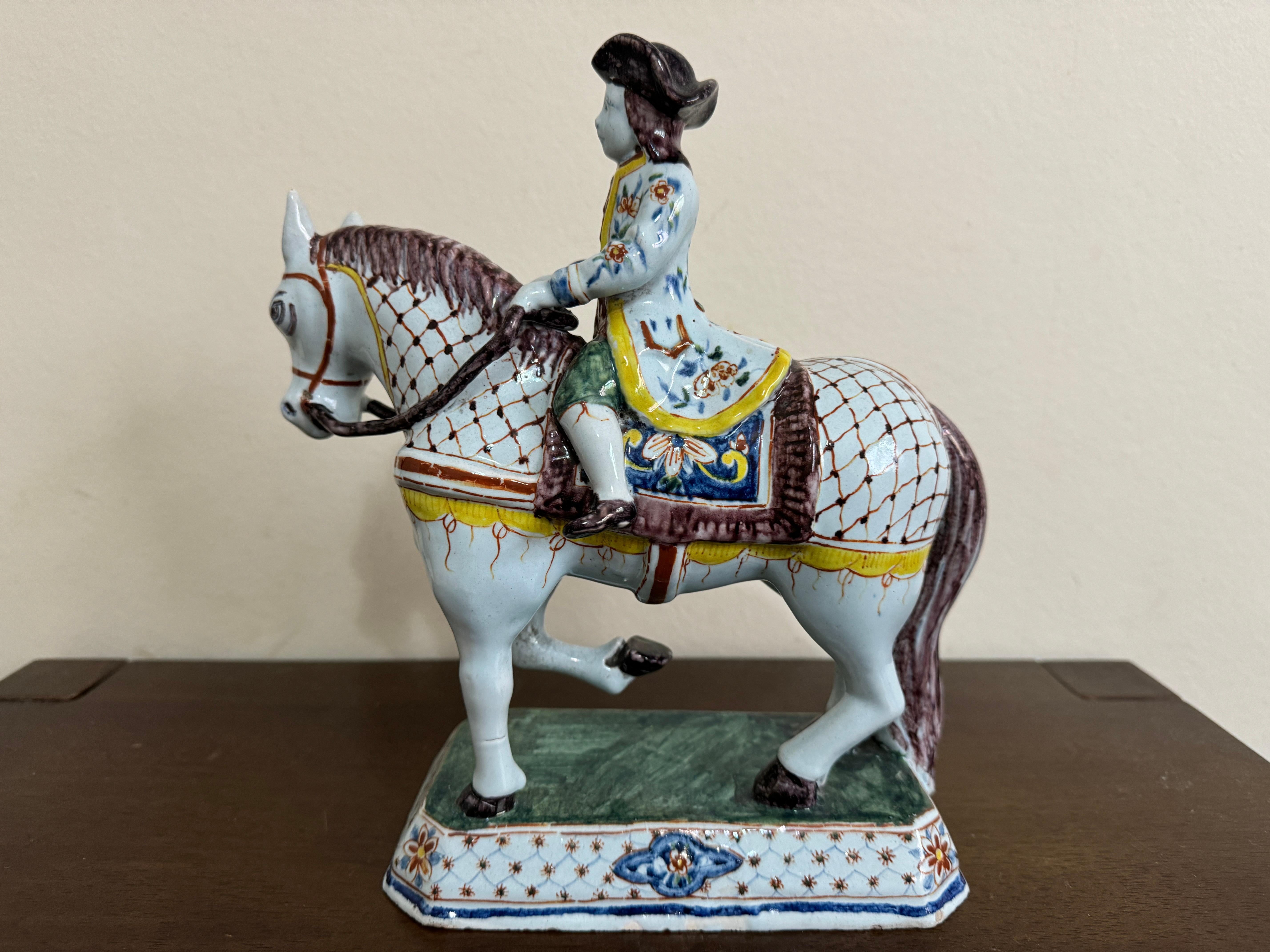 Nineteenth century tin-glazed continental polychrome faience horse, circa1880. Dubious markings (Roos, APK, etc) to the base. 23 cm long, 26 cm high, 10 cm wide.