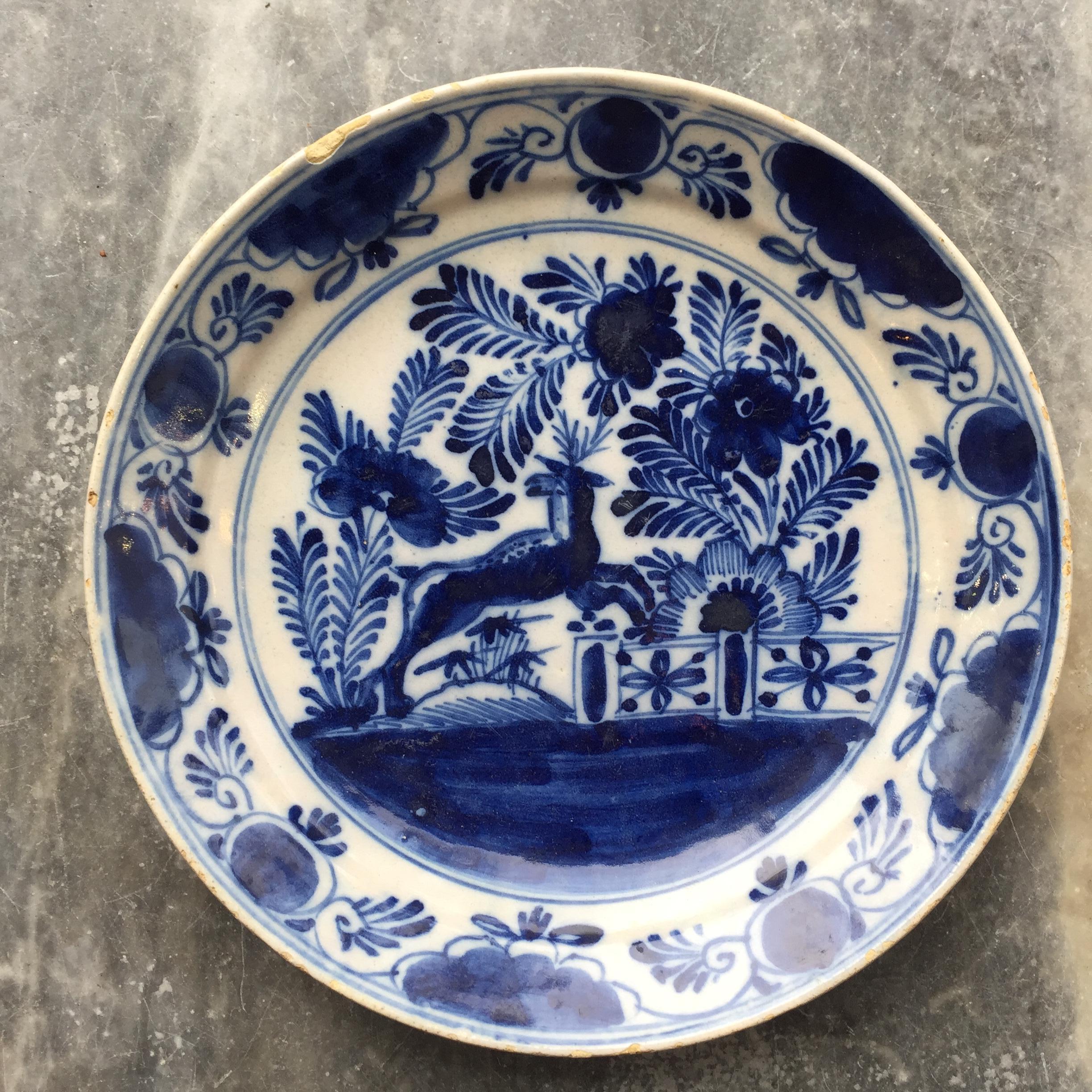 City: Delft
Workshop: Unknown
Date: second half of the 18th century

A blue and white Dutch Delft plate with the decoration of a deer in a garden. 

Unmarked.