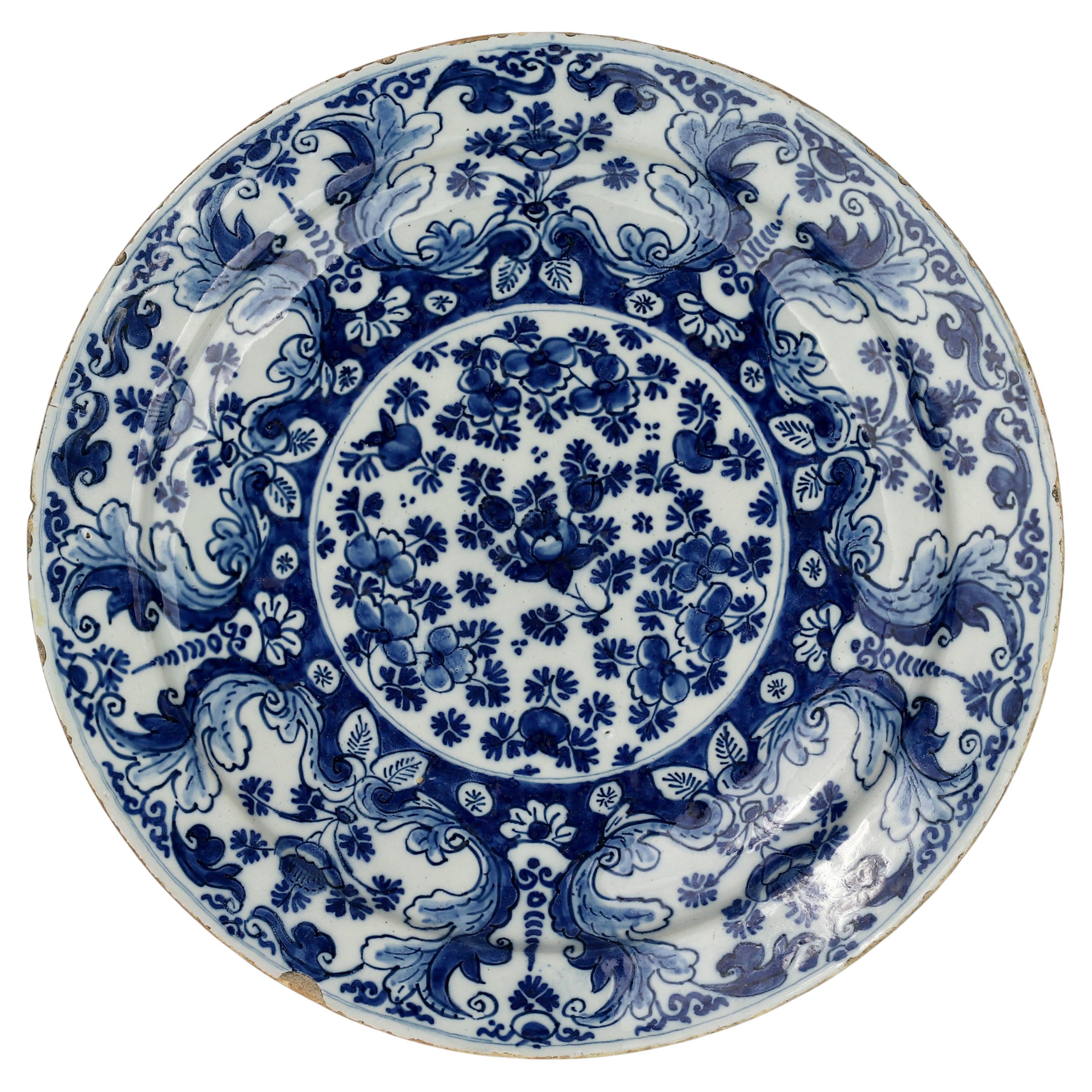 Dutch Delft Plate with Floral Design, 18th Century For Sale