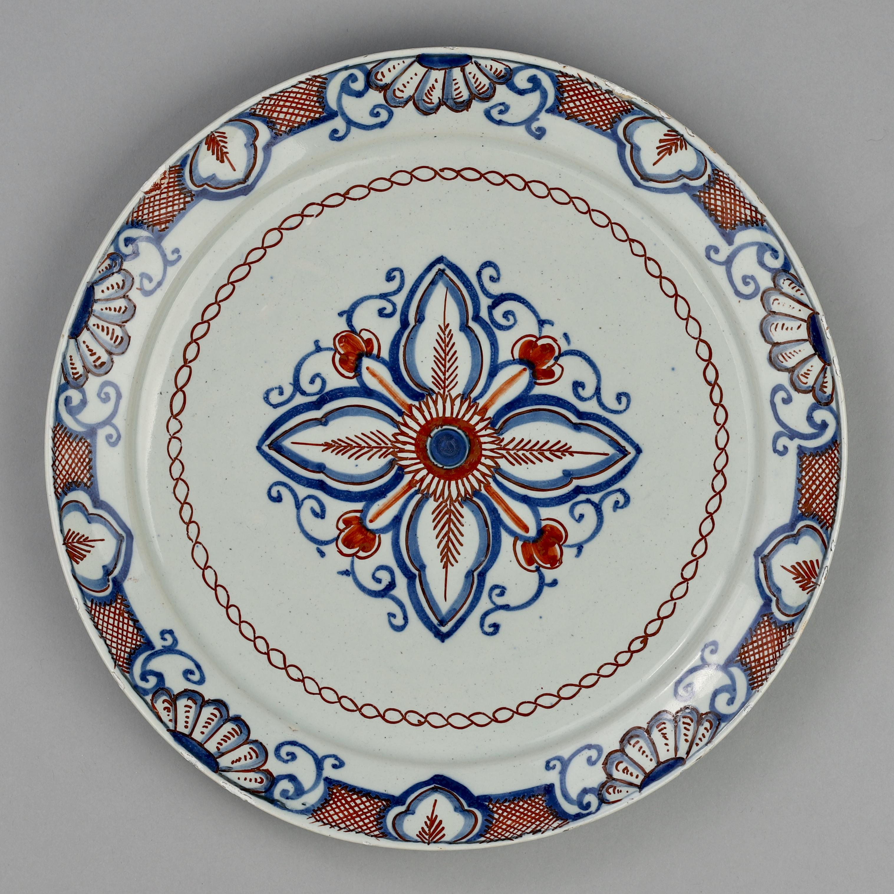 Glazed Dutch Delft Plate with Flower, 18th Century For Sale