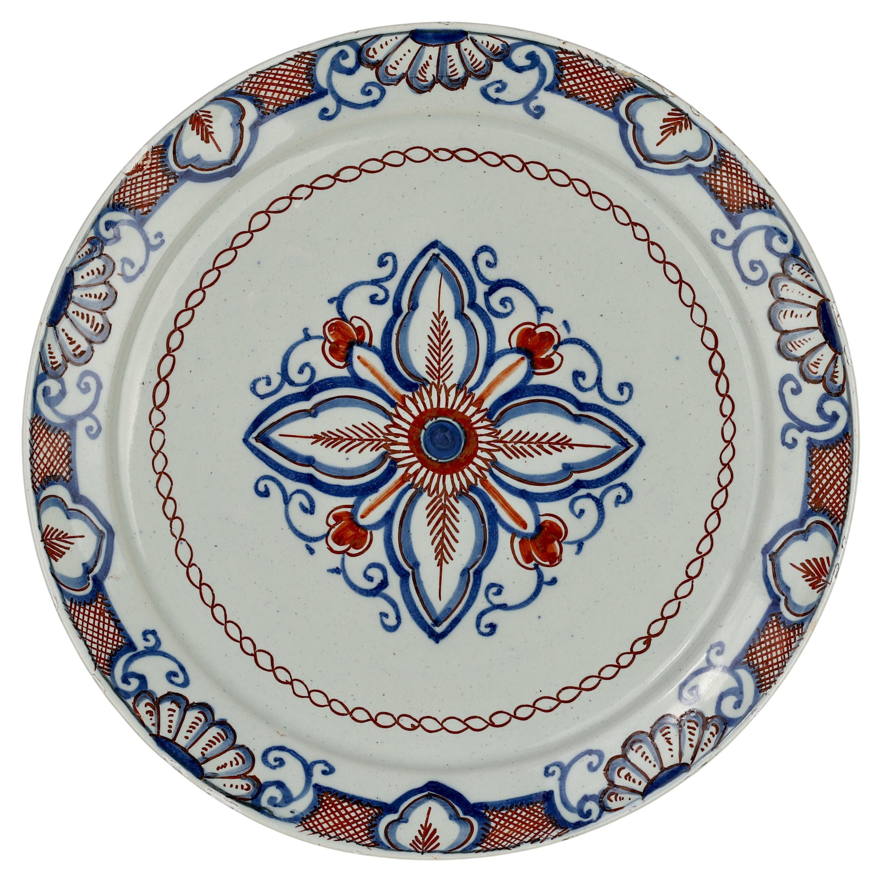 Dutch Delft Plate with Flower, 18th Century For Sale