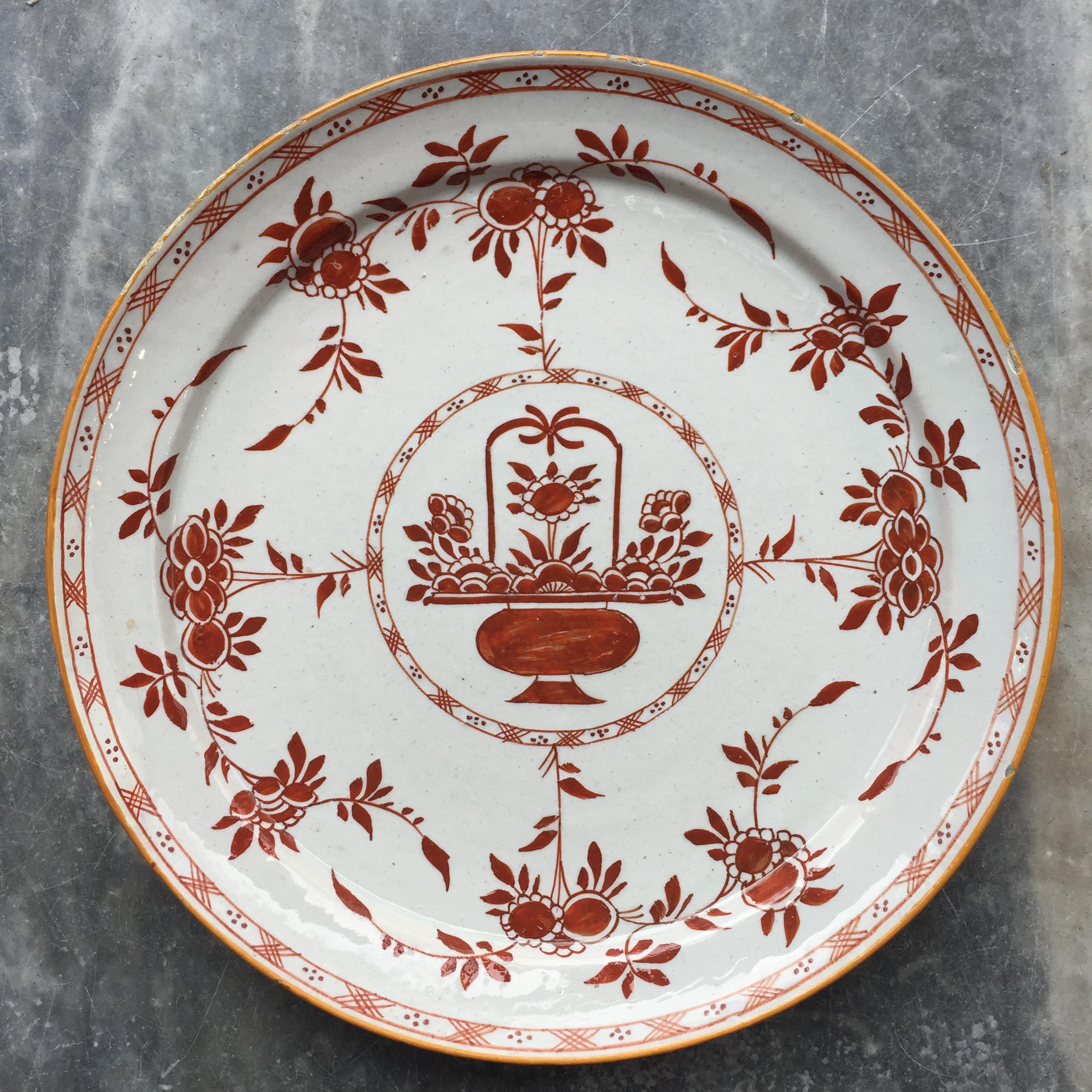 City: Delft
Workshop: De Grieksche A
Owner: Jan Theunisz Dextra
Date: 1758 - 1764.





Plate with decoration in iron red of a flower basket in a circle. Branches with flowers grow out of the circle.

Marked: D 7