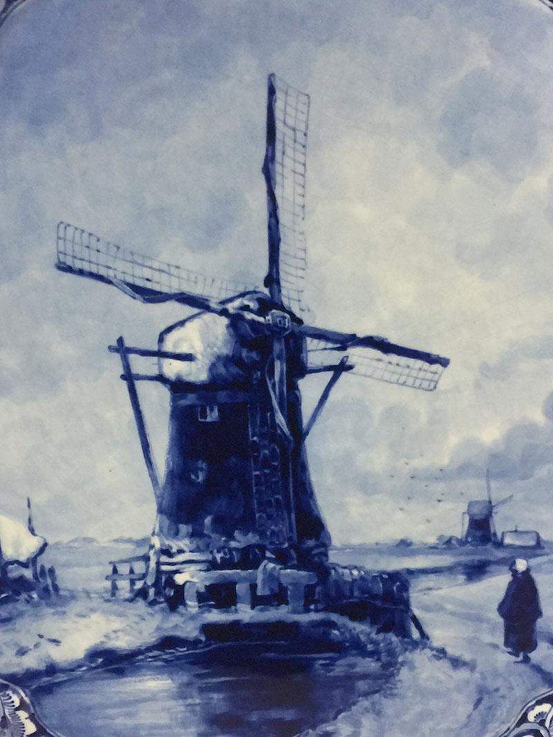 Dutch delft Porceleyne Fles applique after a painting by Louis Apol, 1908

An oval applique with an image after a painting by Louis Apol (1850-1936). 
A scene of a winter landscape with a mill

The applique has crackle, which is common in the