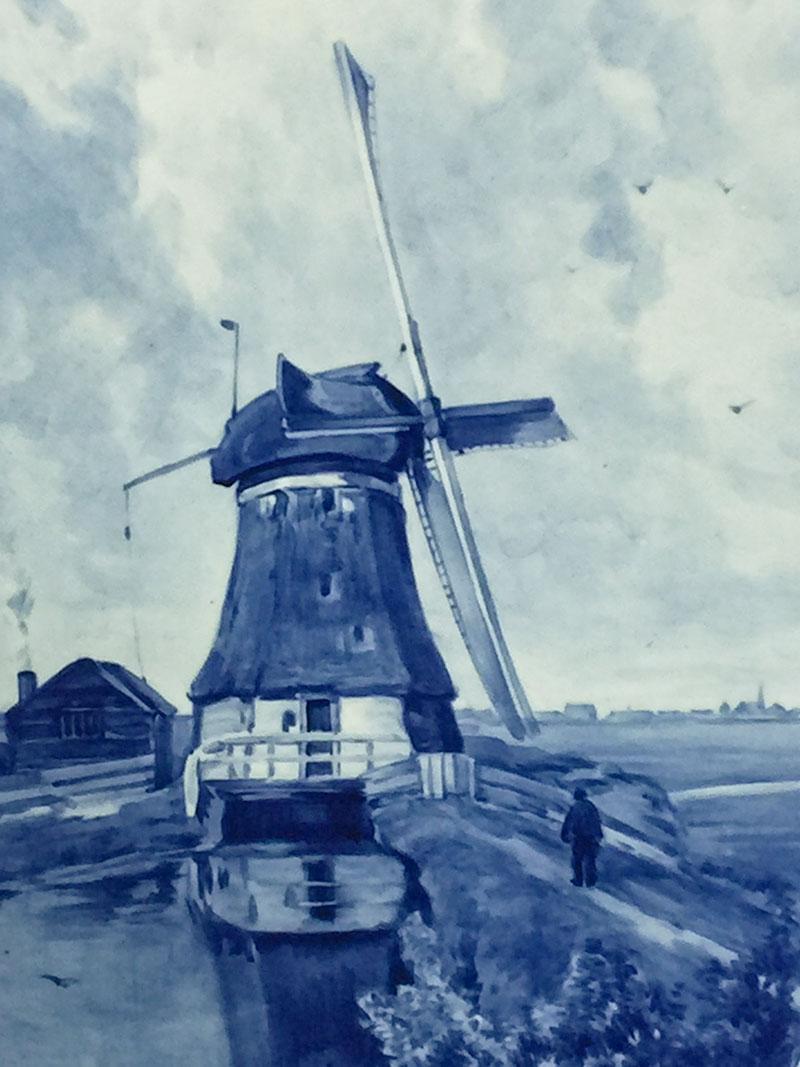 Dutch delft Porceleyne Fles applique after a painting by P.J.C. Gabriel

An oval applique with an image after a painting by Paul Joseph Constantin Gabriel (1828-1903). An image of a windmill in a polder canal. Also known as 