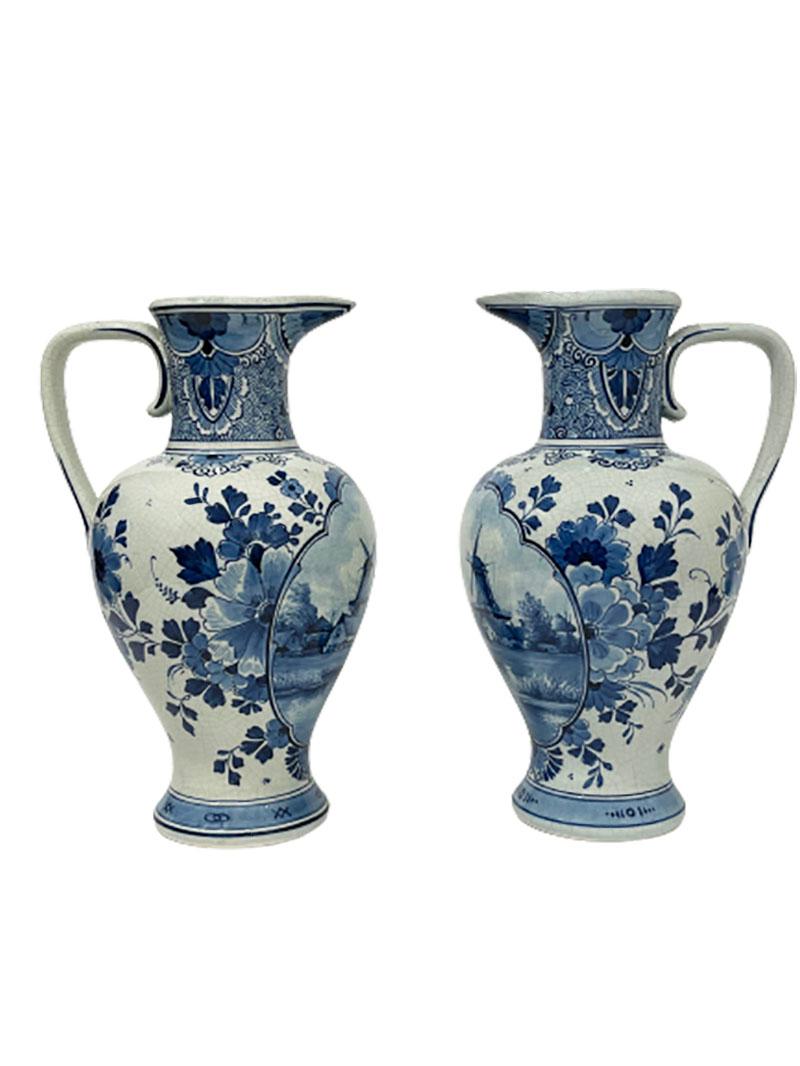 Dutch Delft Porceleyne Fles jugs, 1893

Two Delft Porceleyne Fles jugs with in medallion painted landscape scenes with a windmill and floral decoration. 
The vases are from the year O = 1893 and painted by G. van Heijnenoort (1891-1940) and