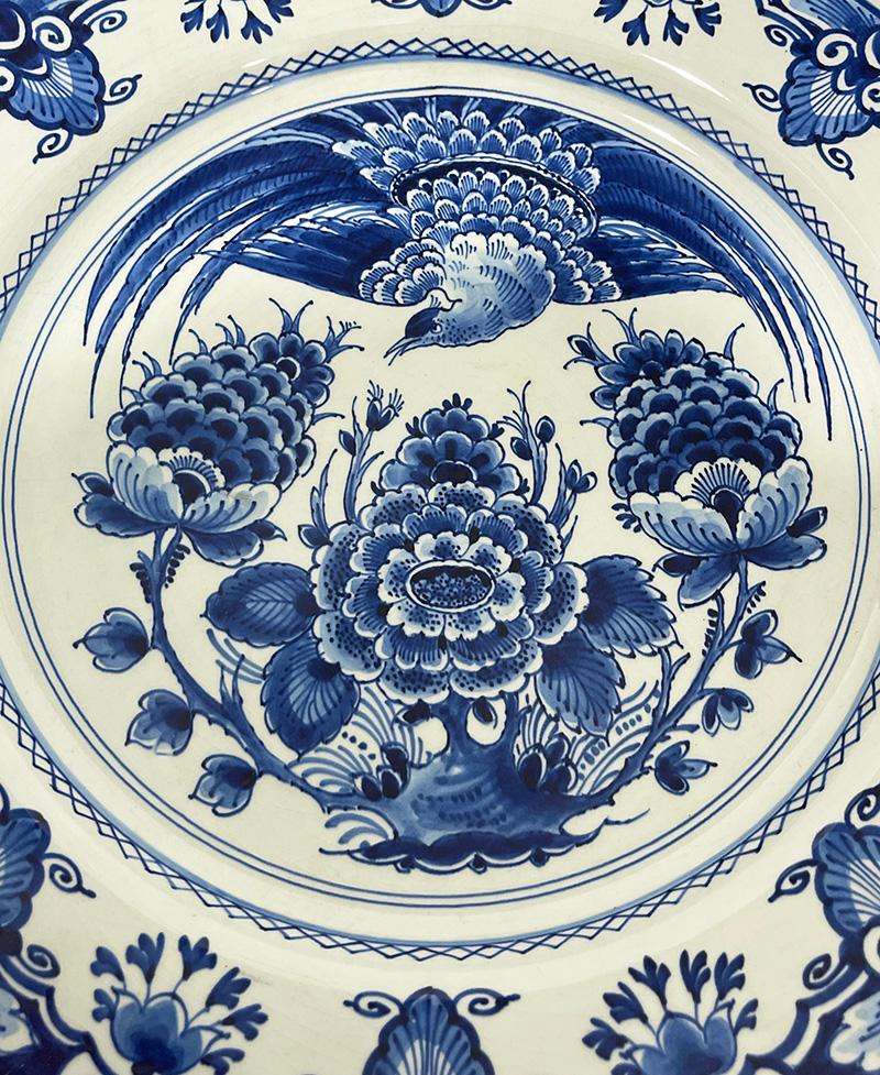 Dutch Delft Porceleyne Fles wall plate, 1960

A large wall plate with a floral and peacock decor. The wall plate with craquelure and on the back the mark of The Royal Porceleyne Fles, dated CE for 1960 and model # 474
The measurement is 34,8 cm