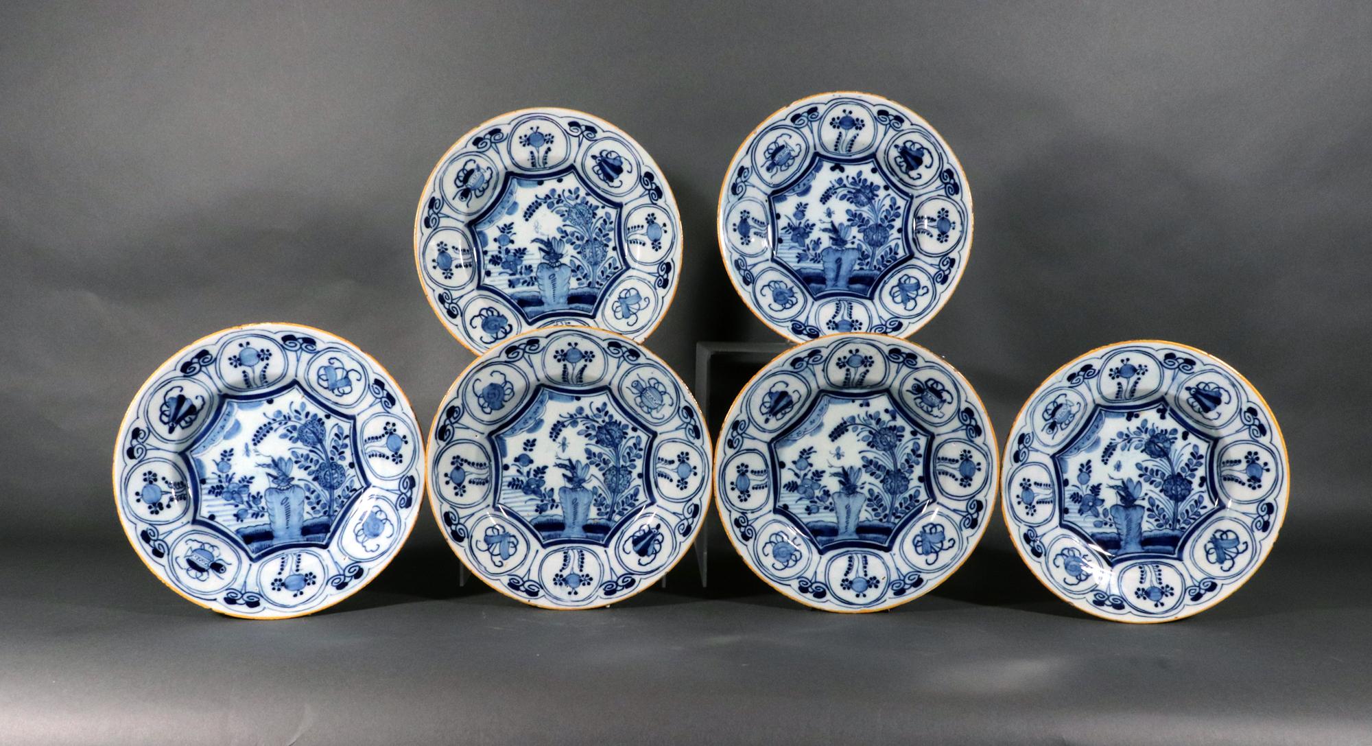 Dutch Delft Underglaze Blue & White Chinoiserie Dragonfly Plates, 
De Klaauw Factory (The Claw Factory),
Circa 1750

The set of six Dutch Delft Chinoiserie plates depicts a large dragonfly sitting on a large blue rock in a stylized Chinese garden. 