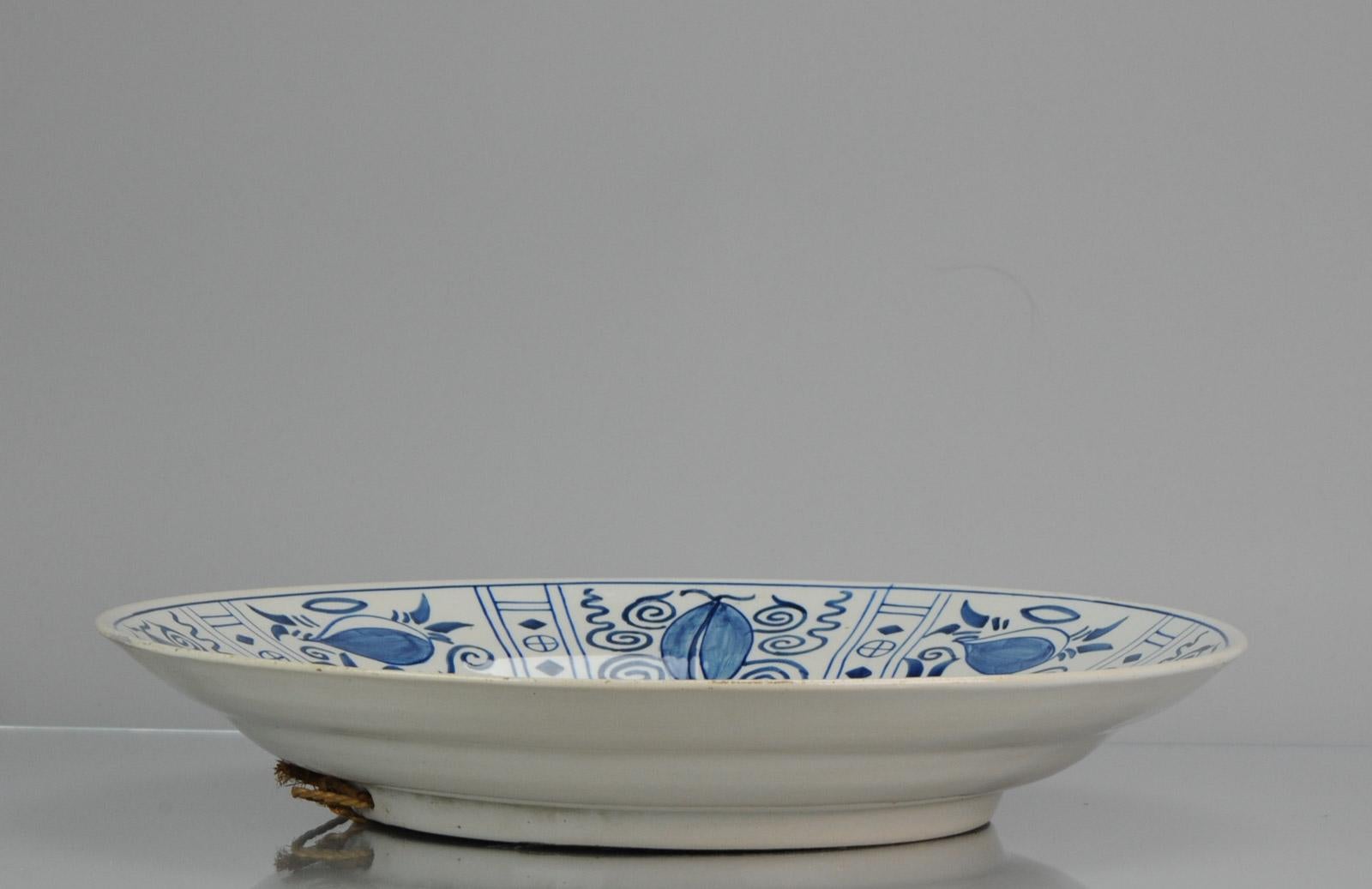 Lovely and large Dutch Delftware remake of a wanli kraak charger. Beautiful collectors piece.

Additional information:
Material: Porcelain & Pottery
Region of Origin: Europe
Period: ca 1900 
Condition: Overall Condition Filled chips and some small