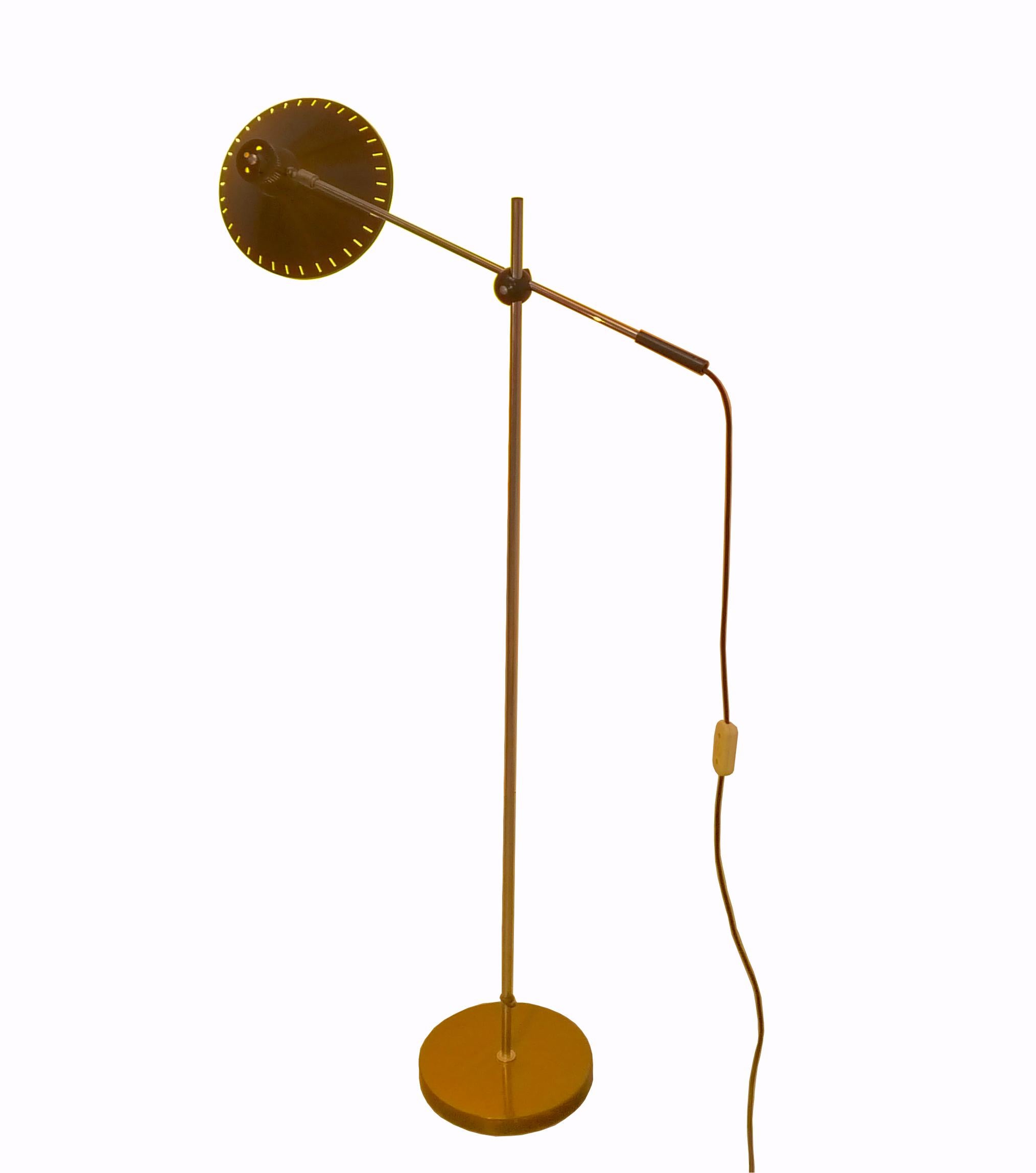 Adjustable Anvia floor lamp designed by J. Hoogervorst in ca.1960. This aluminum lamp is fully adjustable and suitable for direct light to read or indirect light on the wall or ceiling. Considering its age this vintage floor lamp is in good and