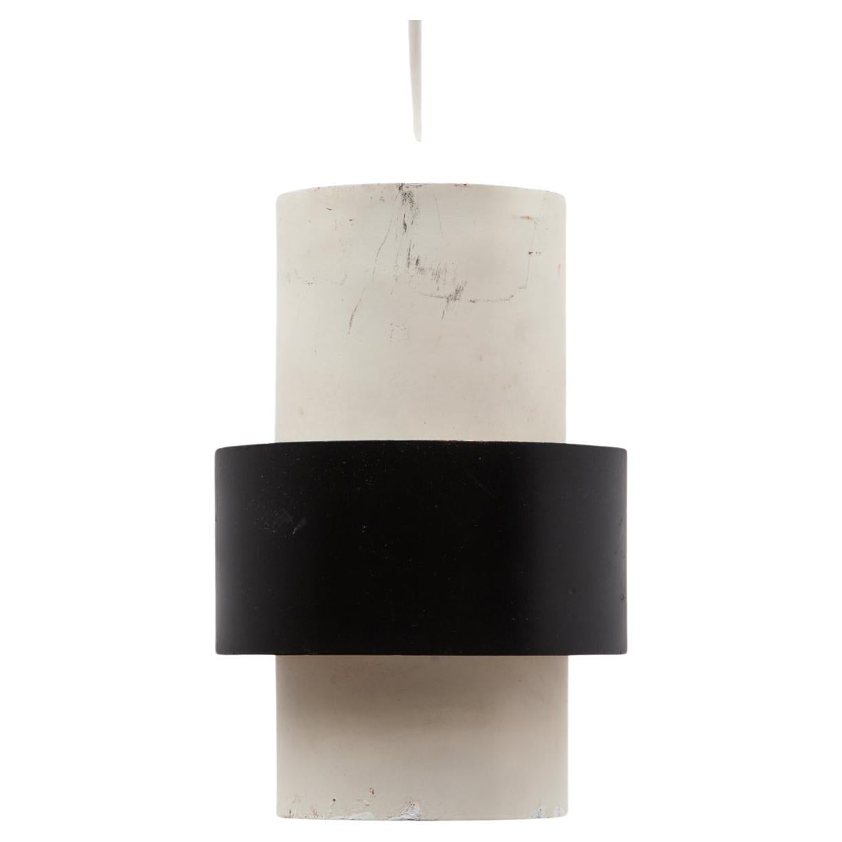 This mid-century Dutch design hanging lamp was designed by Kalff. The inside of the cylinder and the outside of the drum have a layered shape, crafted with a mixed metal aesthetic, in white and black. Three lamps available.