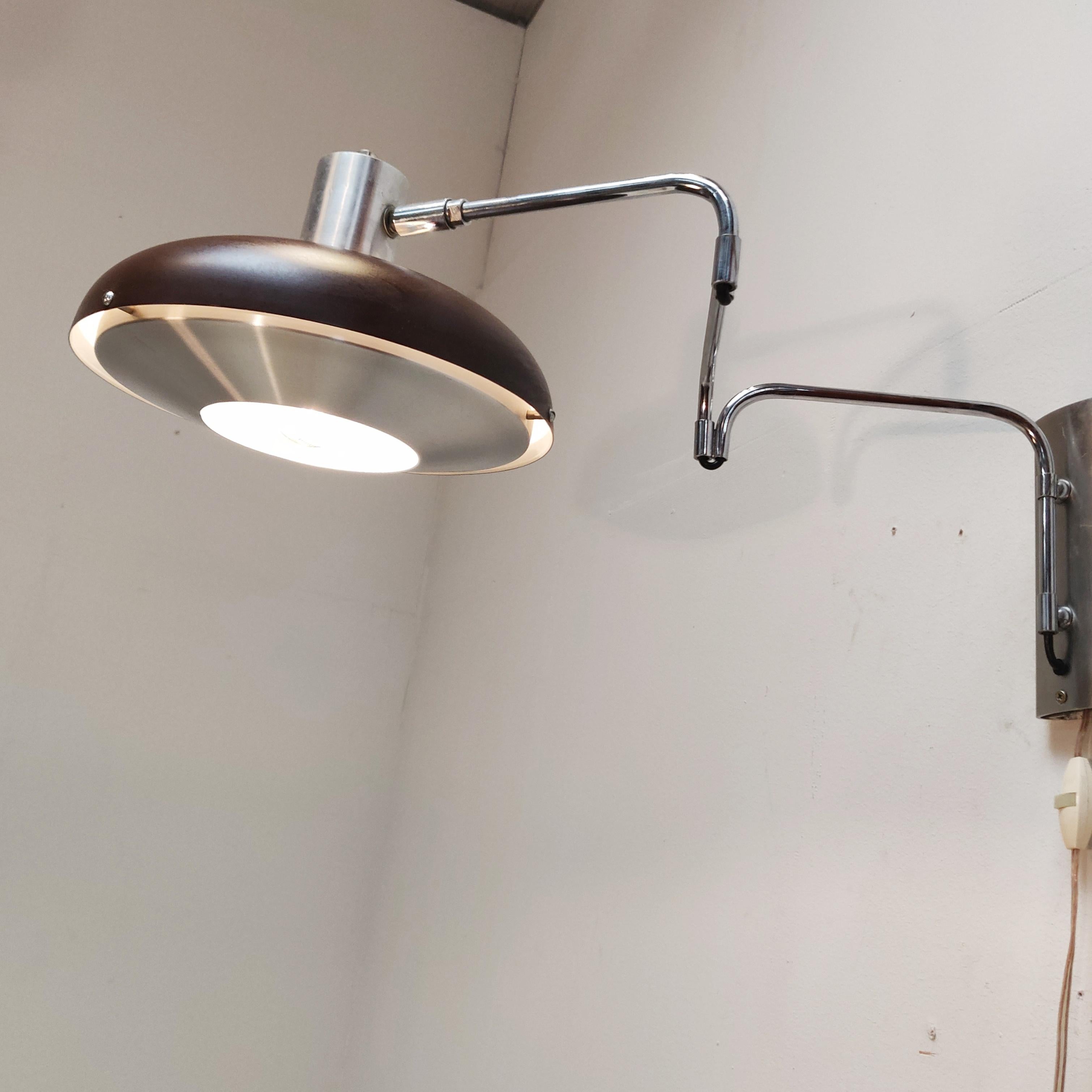 Dark brown and aluminum colored articulating wall lamp by Lakro Amstelveen with 3 chrome arms and a mounting plate. The shade has an aluminum diffuser.

