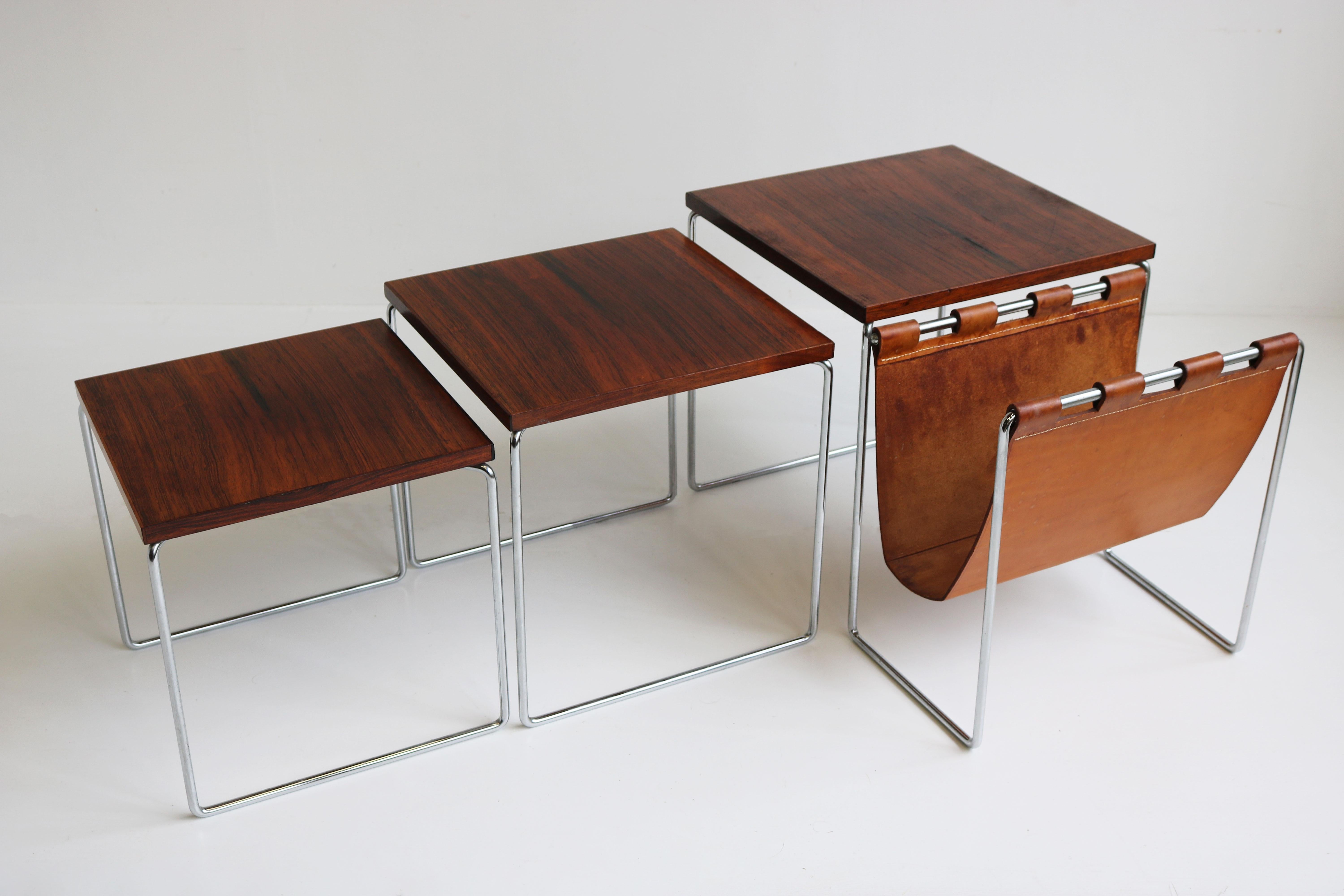 Marvelous Mid-century modern design nesting tables with Magazine holder Dutch design by Brabantia 1960.
The combination between chrome, rosewood & warm leather makes these tables timeless and a pleasure to look at. 
Very practical with the