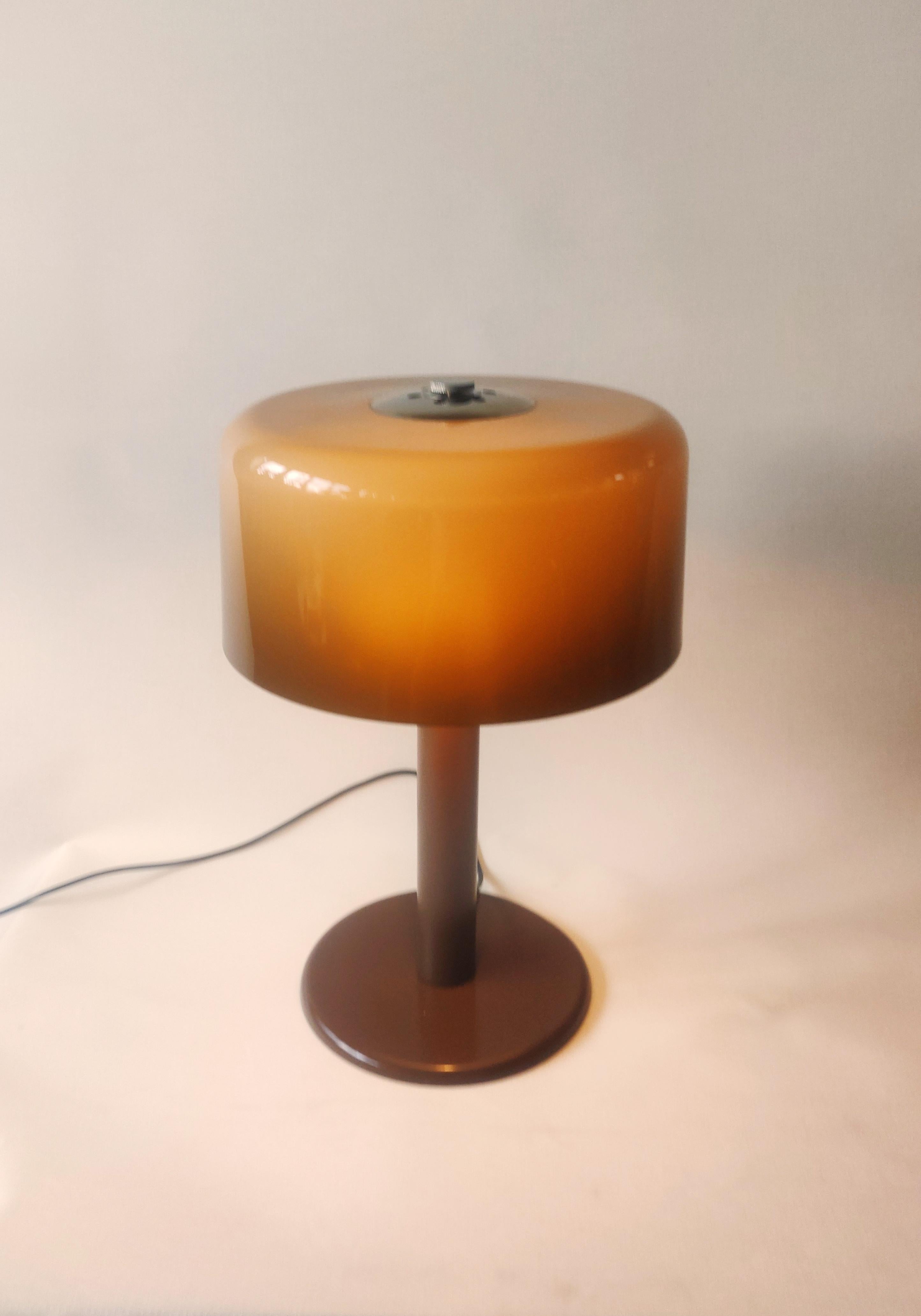 Midcentury Table lamp by Dijkstra Lampen, 1960s.
Space Age table lamp with Lucent brown acrylic lamp shade in style of Harvey Guzzini. 
The lamp needs 2 E14 light bulbs and its wiring has been inspected.

The Dijkstra company was founded in 1922